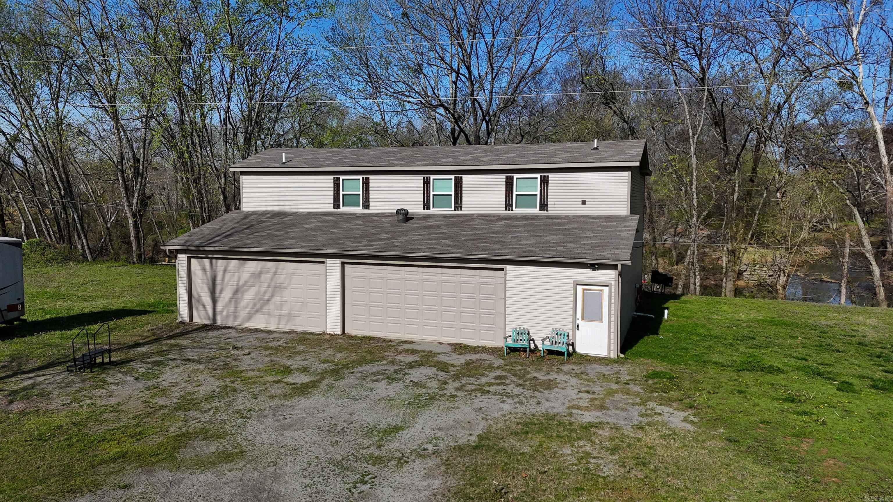 Two Riverfront Residences sitting on over 30 acres.  Over 800 feet of Little Red River Frontage. Has a dock installed  Main house was built in 2021  Guest house was built in 2000 Has additional riverfront lot ready to build on if desired City Water and High speed fiber internet is there