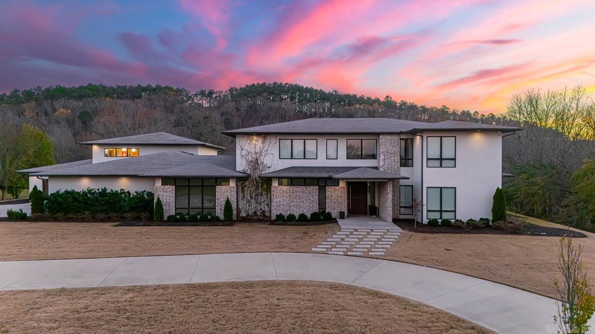 Luxury custom-built estate in West Little Rock on 5+ acres with waterfront access to the Little Maumelle River leading to the Arkansas River! This rare property blends city convenience with the privacy & space of country living. Approx 8,200 sq ft with 6 beds/6 baths and an open-concept design made for entertaining, anchored by a spacious chef’s kitchen. Main level features a generous primary suite with spa-like bath and large walk-in closet, plus a guest suite with en-suite bath, formal dining room, office/bonus space, a media room, & an indoor BASKETBALL court + GYMNASIUM!! You've got to see it! Upstairs offers 4 additional bedrooms (2 en-suite, 2 connected by a Jack-and-Jill bath), a playroom, & extra living space. Outside is truly next level: resort-style pool & a riverfront dock. Plenty of room for recreation, gardening, livestock, or agriculture, all with peaceful waterfront views. A one-of-a-kind Little Rock luxury home with land, amenities, and river access. Convenient to shopping, dining, and everyday essentials, yet tucked away on acreage. Ideal for multigenerational living and unforgettable gatherings. Tour it today. Must see!