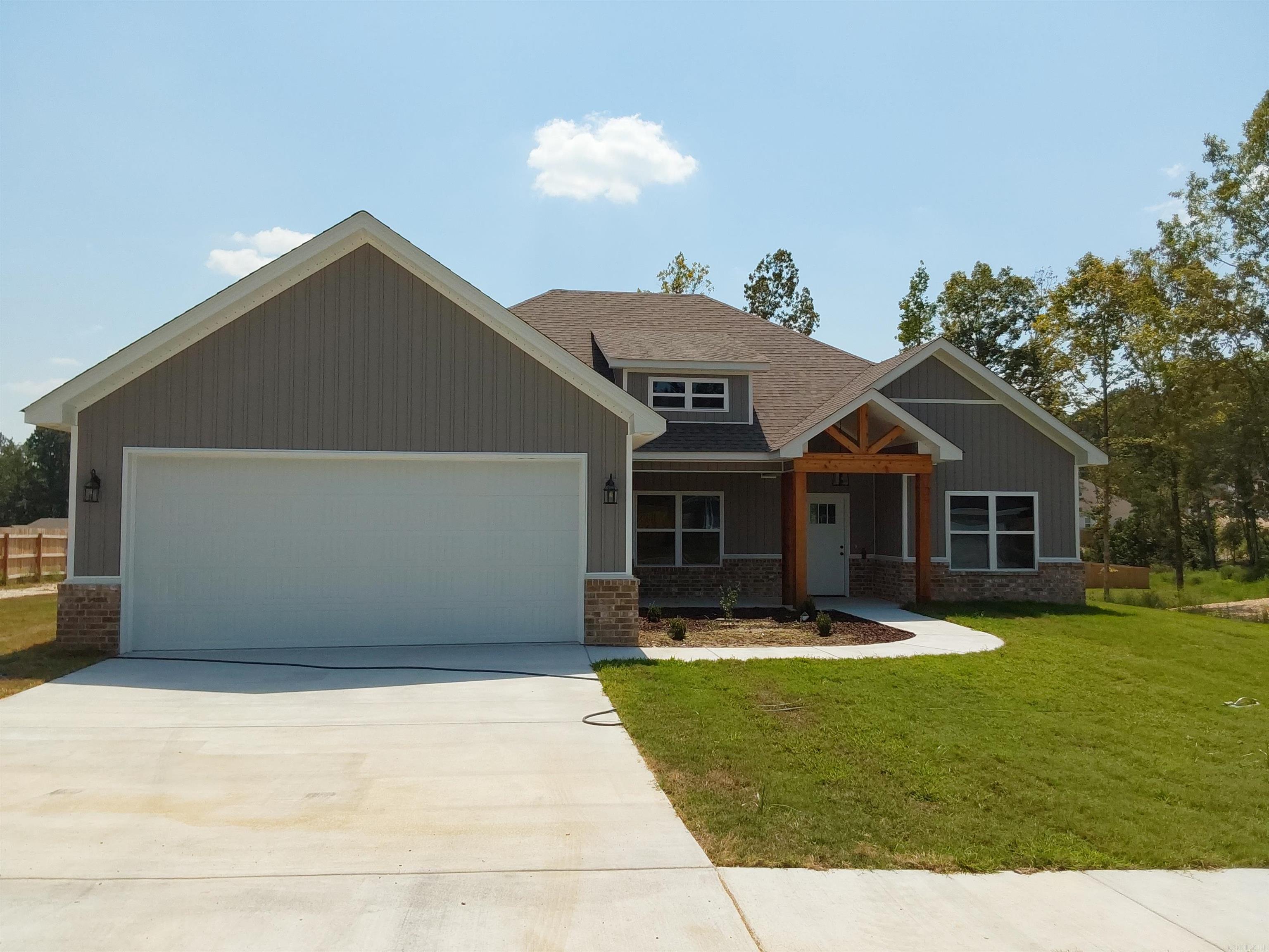 Beautiful new craftsman style home located in Crossroads Village. 4 bedrooms, 2 baths. Custom cabinets, granite countertops, eat-in kitchen, lovely pantry, ventless gas log fireplace, stainless appliances, LVP flooring in main areas, separate laundry room. This beauty is a MUST SEE!!!