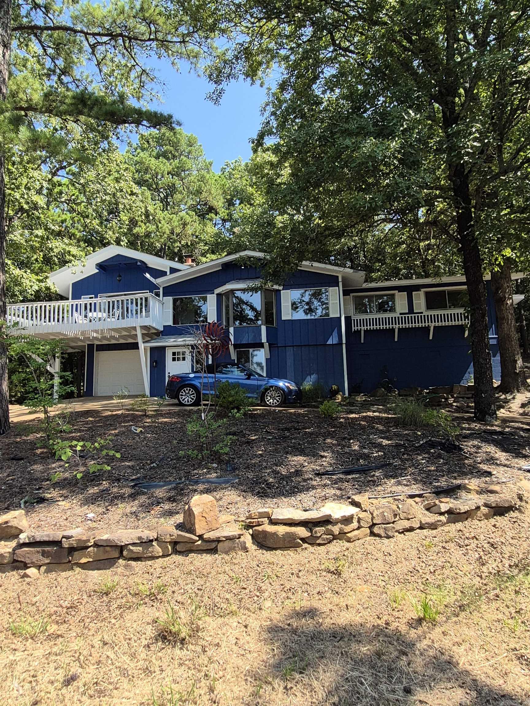 Lovely remodeled home.  Seller will finance credit worthy buyer with 20% down at 5% interest, interest only payment with a two year balloon.  This home has beautiful seasonal lake views from the street.   2 or 3 bedrooms, 2 baths, a great room with a gorgeous new kitchen cabinets, countertops and appliances, and a large separate family room which can function as an office as well, or use as an amazing large MBR with fireplace and private 350' deck with winter lake views.   Adjoining the kitchen is a combo laundry room/butler's pantry with lots of storage and counter space!  Luxury vinyl plank and carpet.  New HVAC in 2020 and new roof in 2020. Private back yard with firepit and abundant entertaining space.  A great vacation get-away or permanent home on large corner lot in a great lake neighborhood.  Being on a septic system reduces the amount of Fairfield Bay dues by over $100 per month.  Non-homesteaded taxes. Call to see this beauty today.  Measured by seller who is an architect.