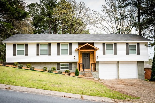 Completely remodeled home in the Walton Heights neighborhood. The  inside features custom built iron handrails, bathroom vanities, tile shower  and tub surround, and shiplap fireplace surround. Inside you will also find  all new paint, trim, blinds, flooring, lights/fans, plumbing fixtures,  hardware, etc. - making this home feel brand new! The outside has a new deck,  newly painted brick, custom painted shutters, and solid cedar portico with  custom iron railing.