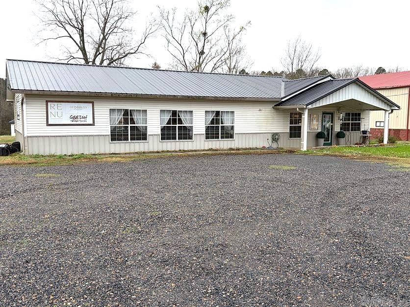 This popular building has been well-known for years as a dance studio, and is still in use as a spa: RE-NU Wellness Barre. Highly visible from Dallas Ave, it features convenient parking, prominent windows and a concrete walk path to the welcoming front porch area. The interior includes a reception area with built-in fixtures, high-end commercial tile flooring, recessed lighting, and a centrally located bathroom. The Studio area, measuring 38 by 30 feet, features floating wood flooring, floor-to-ceiling mirrors, 3 large windows, French doors that open to the back of the building, and access to a dressing area. Then 2 more spacious rooms, currently being used for cosmetology, and a storage area, are found off the well-lit reception area. There are so many possibilities with this property because it lies within the opportunity zone of Polk County.