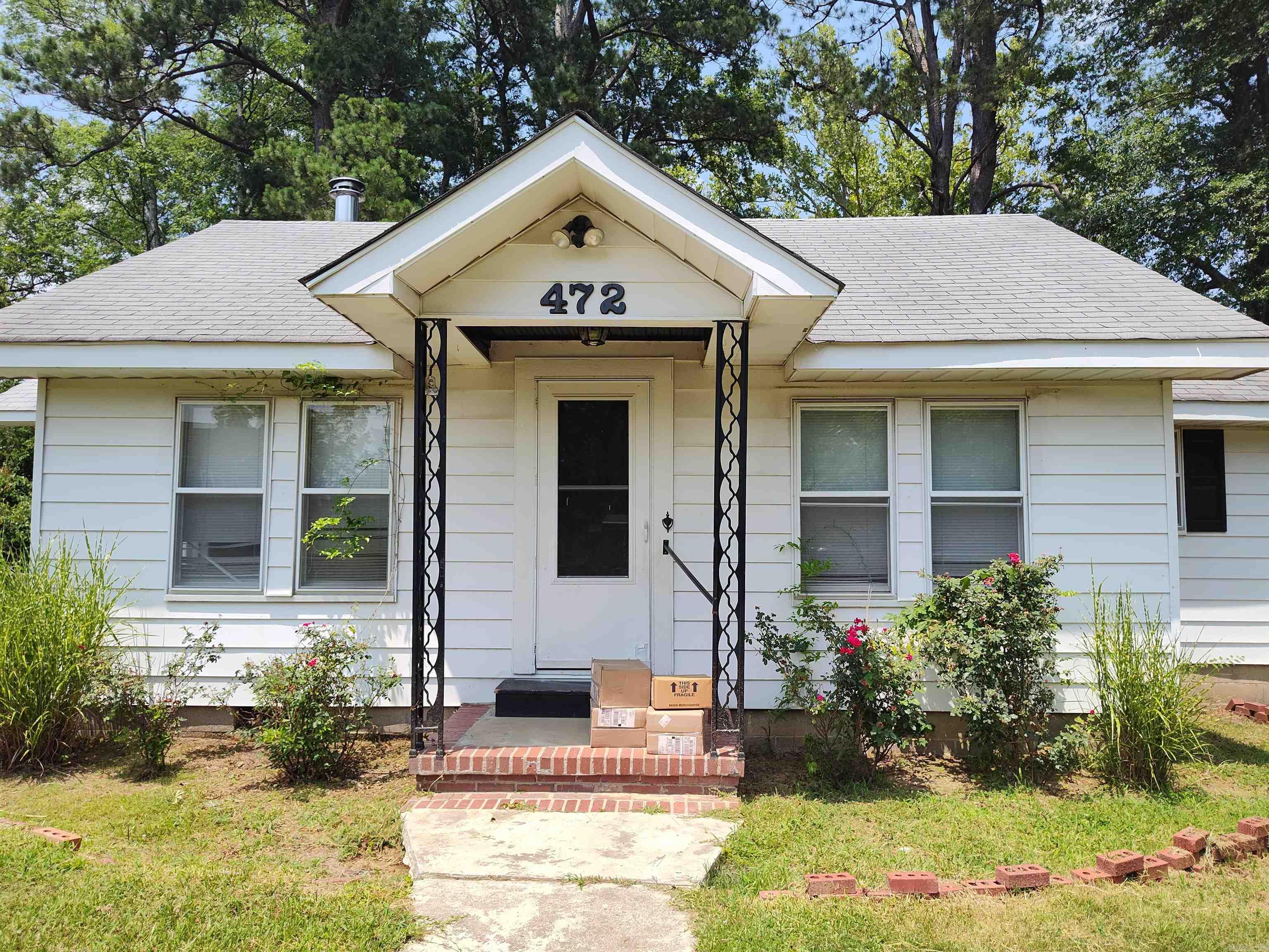 Charming 2-bedroom, 1-bath home on a spacious corner lot. This property features large bedrooms, a mix of vinyl plank and hardwood flooring, and a kitchen equipped with stainless steel appliances. Outside, enjoy a fully fenced yard with a designated area perfect for gardening, plus two storage buildings for added convenience. With ample outdoor space and functional features throughout, this home offers comfort, versatility, and room to grow. Square footage, lot size, and acreage is taken from courthouse records.