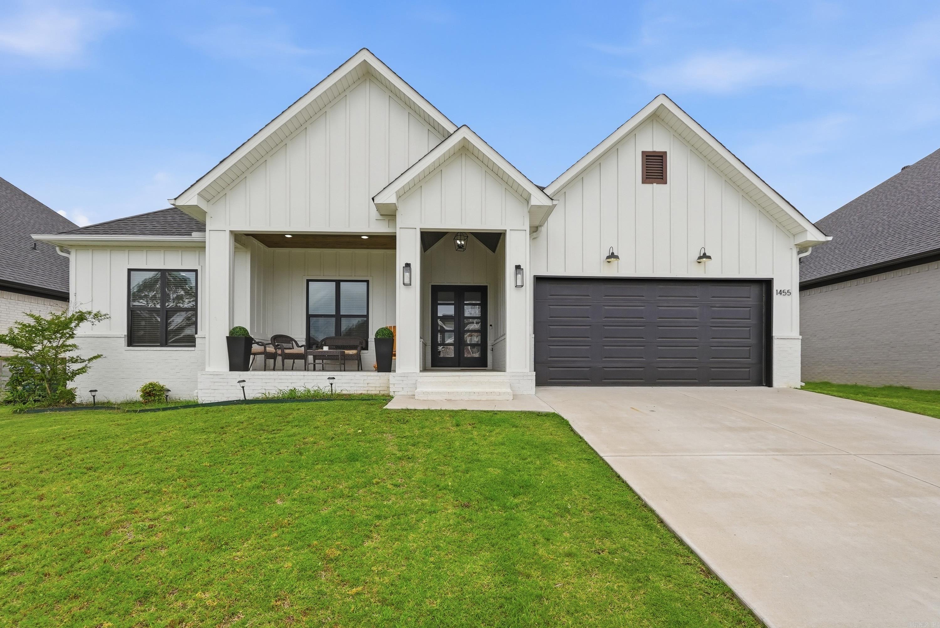 Welcome to 1455 Ronnie Weaver Dr. in Conway, Arkansas, a LIKE NEW, one-level home offering high-end finishes and thoughtful design. Buyers searching for newer homes in Conway AR near shopping, restaurants, schools, hospitals, and easy interstate access will appreciate the convenience and quality this home provides. This 4 bedroom, 2.5 bathroom home offers 2,285 square feet with a spacious open, split floor plan perfect for entertaining. The gourmet kitchen is a standout feature with a 5 burner gas cooktop, pot filler, quartz countertops, huge island with large sink, tiled backsplash, newer appliances, and cabinets extending to the ceiling. The living room features a cozy fireplace and abundant natural light, while the primary suite feels like its own retreat with vaulted ceiling, fireplace, luxury tiled shower, soaker tub, dual quartz vanities, and a huge walk-through closet with custom shelving and soft close drawers. Every bedroom includes walk in closets, and the laundry room offers additional cabinets & sink. Beautiful stained wood ceilings on the covered front & back porches, plus an extended back patio perfect for entertaining. Schedule a tour today! Agents see remarks.