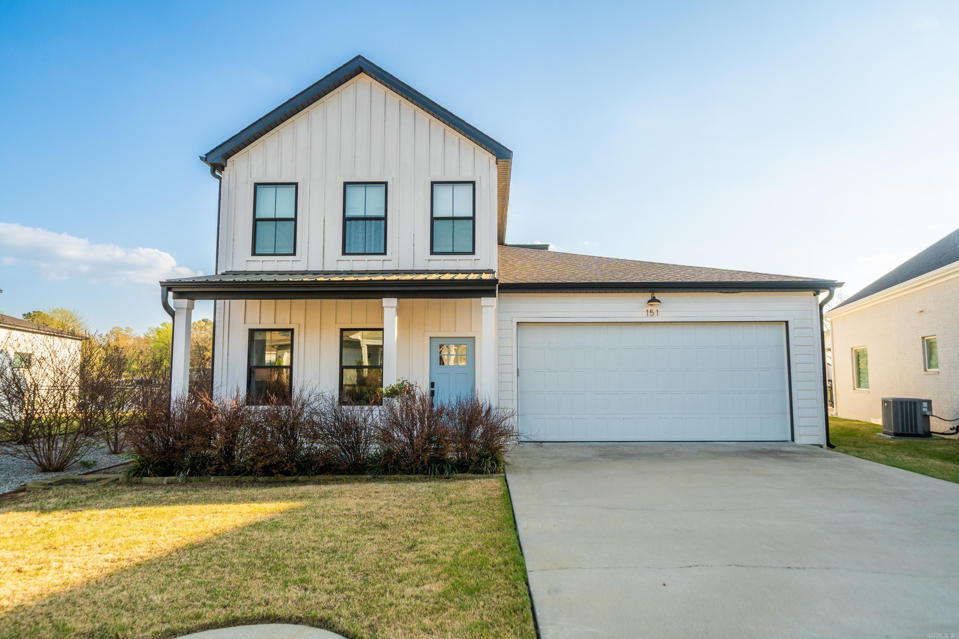 Welcome to this beautiful 4-bedroom, 3.5-bath lake home in the highly desirable Cottages of Bayshore on Lake Hamilton. Thoughtfully designed for both comfort and entertaining, the open-concept floor plan features a spacious kitchen that flows seamlessly into the living area, highlighted by abundant natural light and picturesque lake views. The main-level primary suite offers a private retreat with water views, an ensuite bath, and generous closet space. Additional bedrooms and flexible living areas provide plenty of room for guests, family, or a home office. Quality finishes, ample storage, and thoughtful details are found throughout. Step outside to a covered patio perfect for relaxing or entertaining while enjoying the peaceful lakeside setting. A one-stall boat slip just steps away provides easy access to the water. Whether you're seeking a primary residence, vacation getaway, or investment opportunity, this exceptional property offers the best of Lake Hamilton living. POA dues include lawn maintenance for easy, low-maintenance ownership.