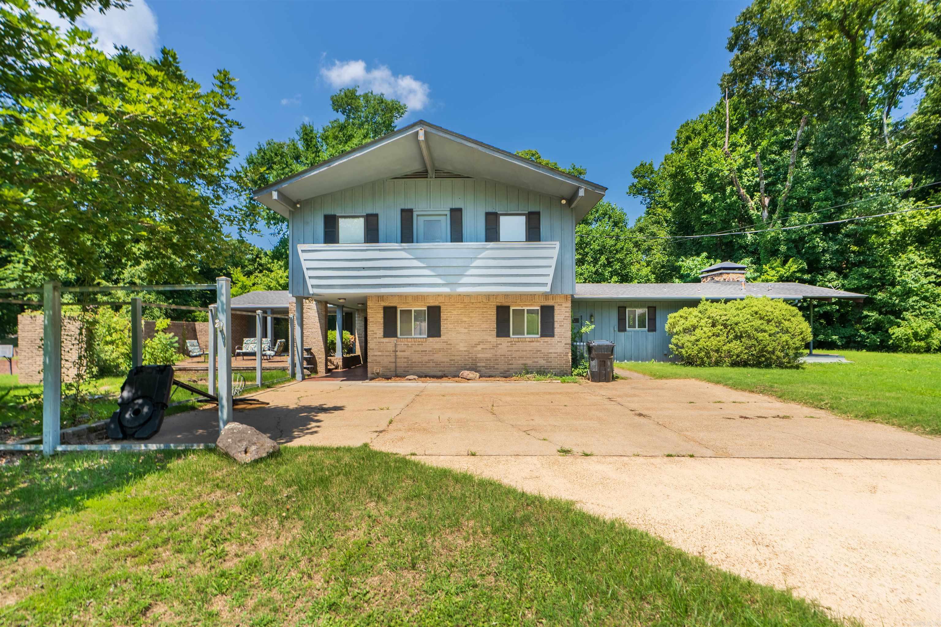Spacious and beautifully maintained 4 bed, 4 bath home in Helena, AR! This two-story gem offers two abundant living spaces, perfect for comfortable everyday living and entertaining. Enjoy the expansive outdoor living area, ideal for relaxing or hosting guests. Inside, you'll find a generous living area equipped with a wet bar, an updated kitchen, and ample natural light throughout. There are two "primary" bedrooms, one on the ground floor and one upstairs as well! Recent upgrades include two brand new HVAC units and a tankless water heater for energy efficiency and year-round comfort. The concrete driveway adds convenience and curb appeal. Don’t miss this incredible opportunity—schedule your private showing today!