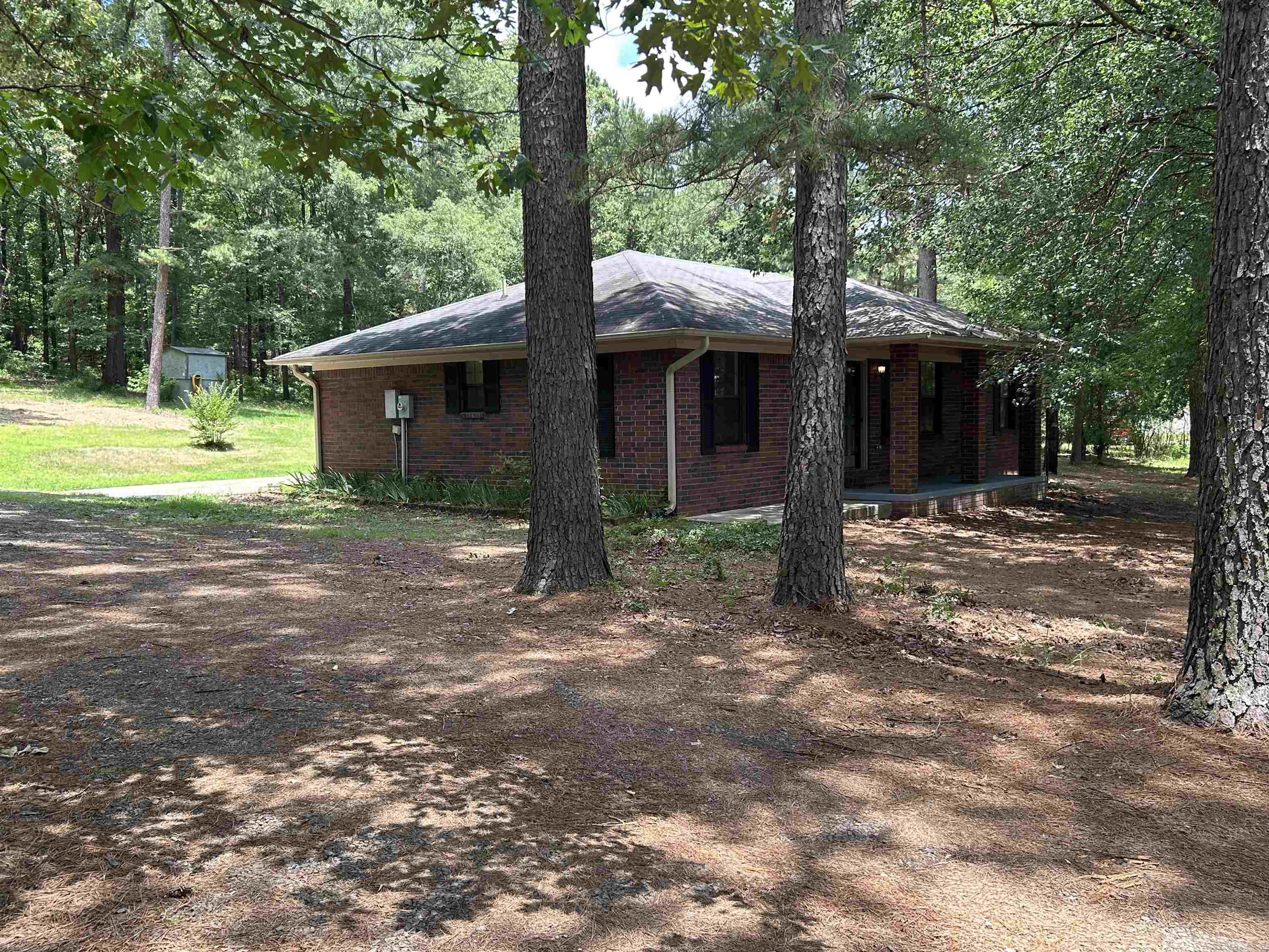 Move-in ready country gem on 1.5 acres! Located just 6 miles west of Perryville, this completely remodeled brick ranch home offers the perfect blend of modern updates and tranquil privacy. Step inside to find brand-new LVP flooring throughout and a spacious, efficient galley kitchen fully equipped with new cabinets, appliances, and beautiful butcher block countertops. Both full bathrooms have been stunningly upgraded with top-notch tiled surround showers, one including a deep soaking tub. Enjoy the ultimate peace of mind knowing the owner has already completed all major inspections —including roof, HVAC, and the septic system. The property features private, quiet neighbors and abuts a timber company to the north, creating a true wildlife haven surrounded by mature pines and hardwoods. Bonus: The attached rear carport is primed to be transformed into your dream outdoor entertainment oasis or a custom four-season room. This one is truly a must-see!