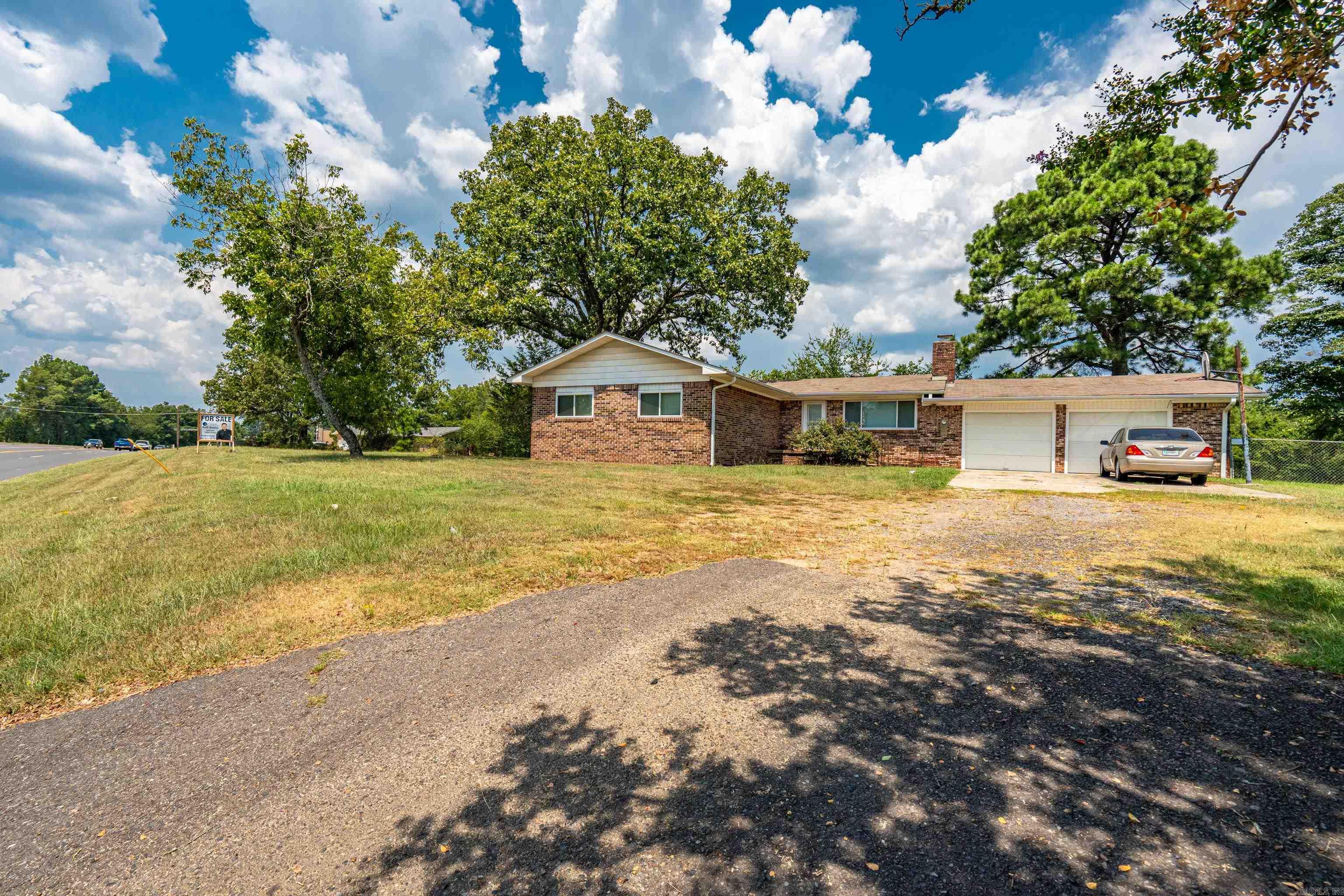 This beautiful, well-maintained home offers the best of both worlds — comfortable living and incredible commercial potential!   Located in a high-traffic area with excellent road frontage and an estimated 18,000+ vehicles per day, visibility is unbeatable. Sitting on nearly an acre, the property includes a fenced backyard and plenty of space to expand or reimagine. Less than a mile from Lake Hamilton Schools, this location is ideal for:  Small café or coffee shop  Boutique or retail space  Office conversion  Residential-based business  Investment property Close to shopping, restaurants, and everyday conveniences — yet still offering that peaceful country feel.  With continued area growth, this is more than a property… it’s an opportunity.