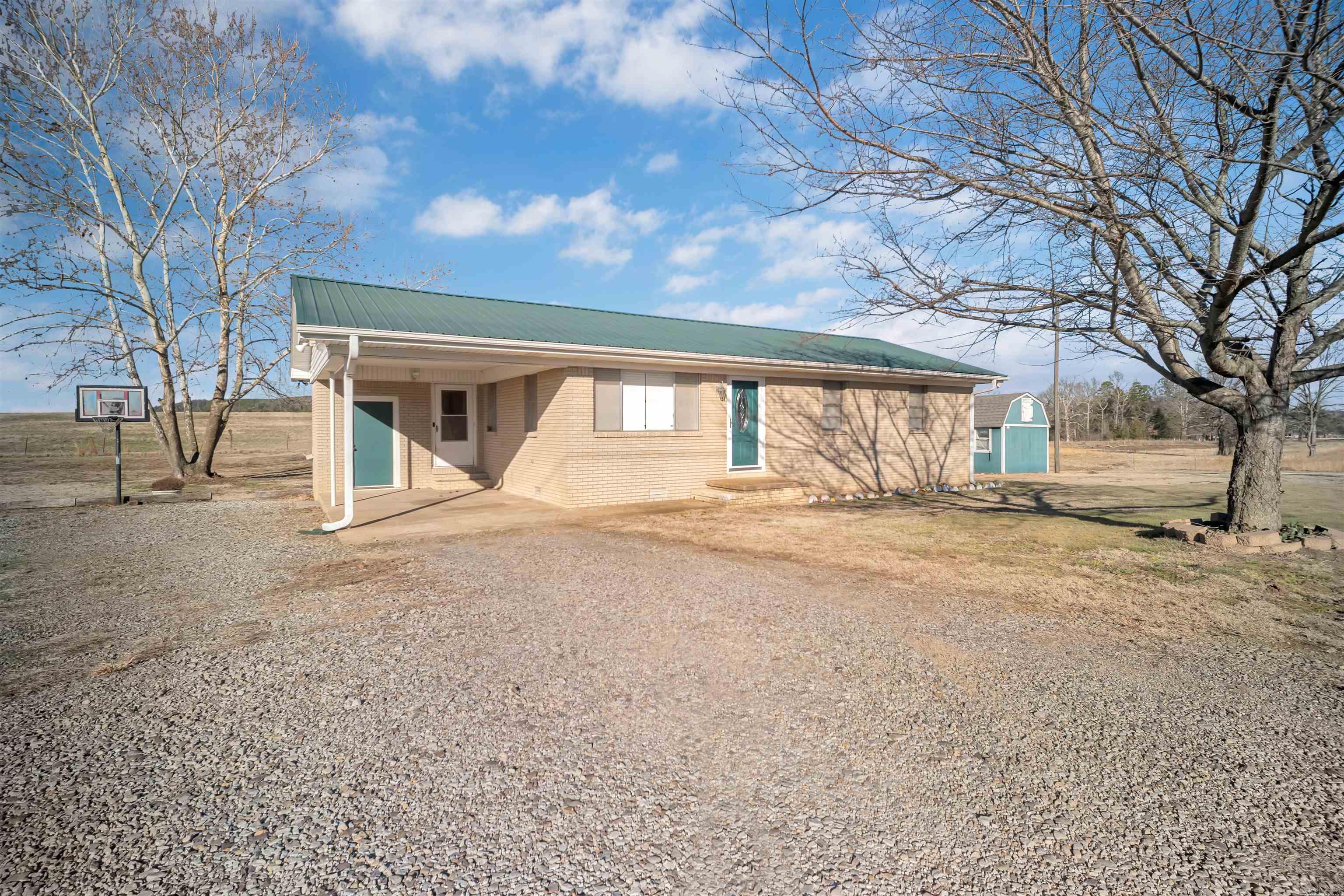 Want a perfect blend of country charm and convenient access? Look no more! 3/1, fresh paint and new flooring thru the whole house. Outside, you've got some great extras: a fire pit for chilling, a storm shelter for safety, and an outdoor building for storage. Plus, the inside has been freshened up with new paint and flooring, which is always a nice bonus! Located in the Wonderview School district.