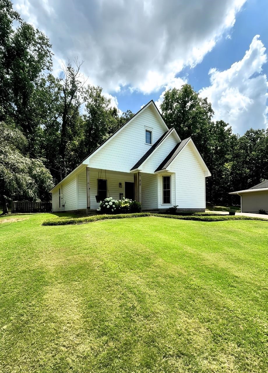 Custom 3 bedroom home across the street from Cherokee Village North Golf Course. This beautiful home with over 1,700 square feet of living space features 3 bedrooms, 2 baths, living room, spacious updaterd kitchen, architectural singles new in 2022, 2-car carport, big front yard and a nice patio area in the back. You are located across the street from the North Golf Course and walking distance from the South Fork of the Spring River.