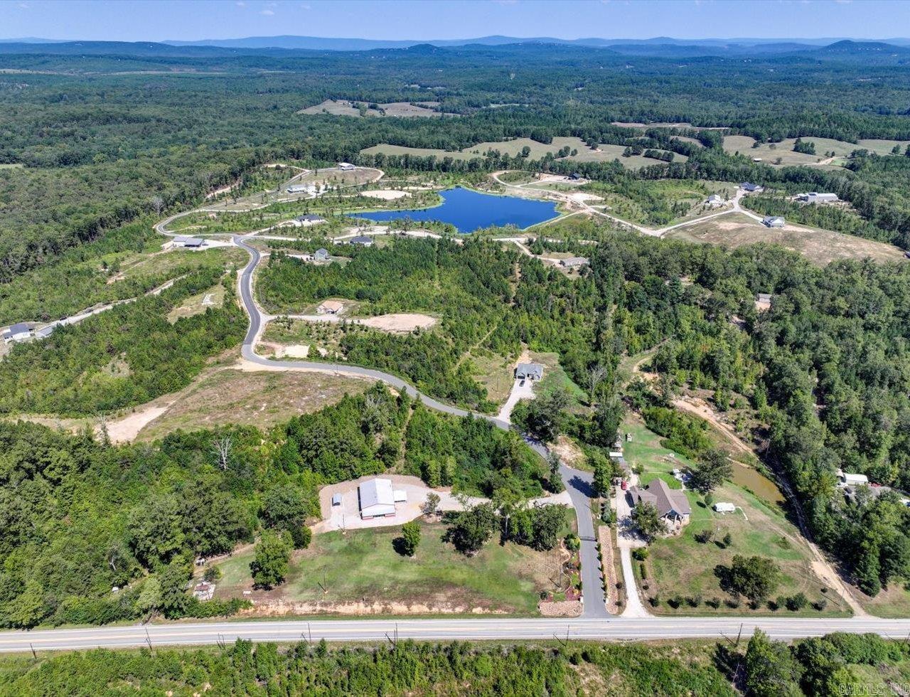 Discover the ideal setting for your future home on this beautiful 3+/- acre lakefront lot in the gated community of Otaza Lake Estates. Conveniently located between Hot Springs and Hot Springs Village with easy highway access, this property offers a rare combination of privacy, natural beauty, and convenience.  The lot has been successfully perk tested in three separate locations, providing multiple potential homesites and added flexibility as you plan your custom build. Enjoy peaceful lake views, mature natural surroundings, and the quiet atmosphere of this well-maintained community.  Whether you’re planning a full-time residence or a weekend retreat, this property offers an exceptional opportunity to build in one of the area’s most desirable lakefront neighborhoods.  Agents: Please call Showing Service to schedule all showings. Gated community—appointment required for access.