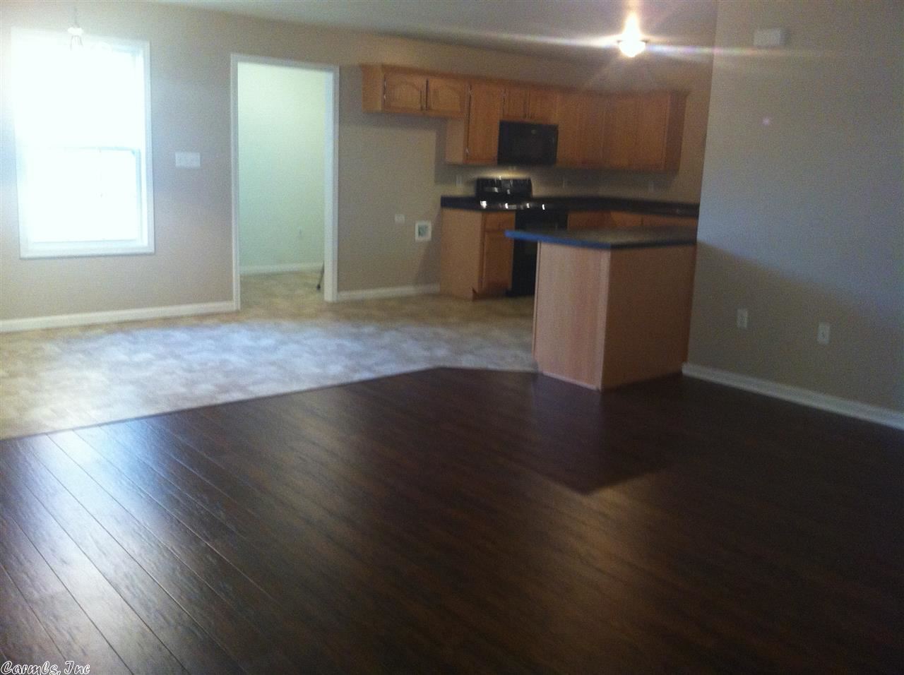 7 years NEW -  Oak Grove... Lots of storage in the maple cabinetry, plus more under the breakfast bar. Black appliances stay.  Walls painted a subtle taupe to blend with the  Hand Scraped Oak Laminate in living room and peppered carpet in the bedrooms....  Quiet street, which is scheduled to be paved in 2016.  Nice size patio for family, and entertaining your friends.  See it TODAY!!!
