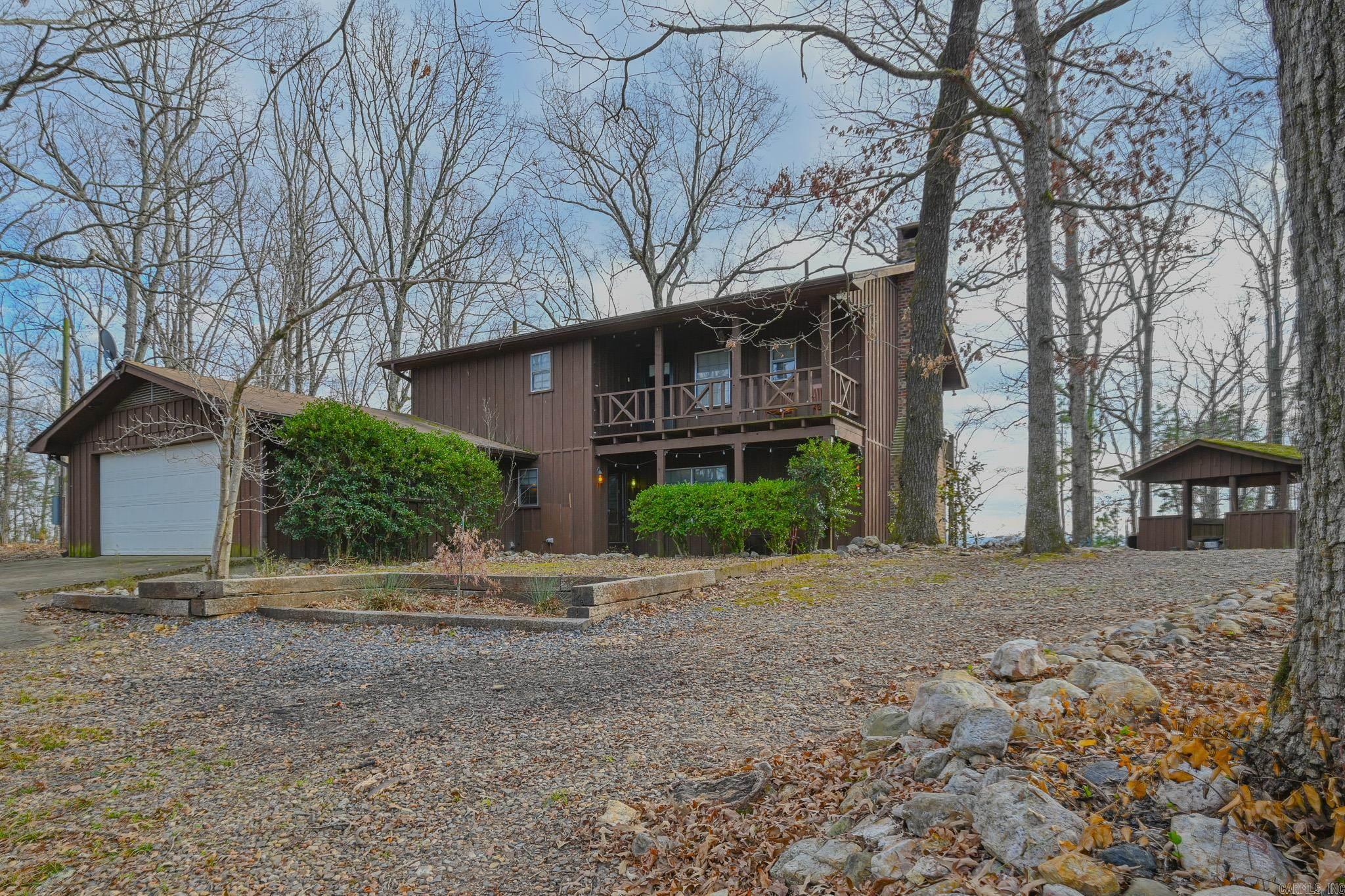 Breathtaking and private, this incredible hilltop property (with VIEWS) is in the heart of the Ouachita mountains and just 15 mins from Mena! With 1200 ft. of river frontage, a well kept 3bed 2.5 bath home, and 73 beautiful acres, this DREAM, country property won’t last long! Features include a large barn, a newly renovated tiny home, a “Yoderbilt” greenhouse, wood & equipments sheds, 2 wells, a state of the art wood powered stove, a wood fireplace, 500 gallon propane tank, 2 sprawling decks, established livestock fencing and stalls, garden beds, a new river deck and so much more!