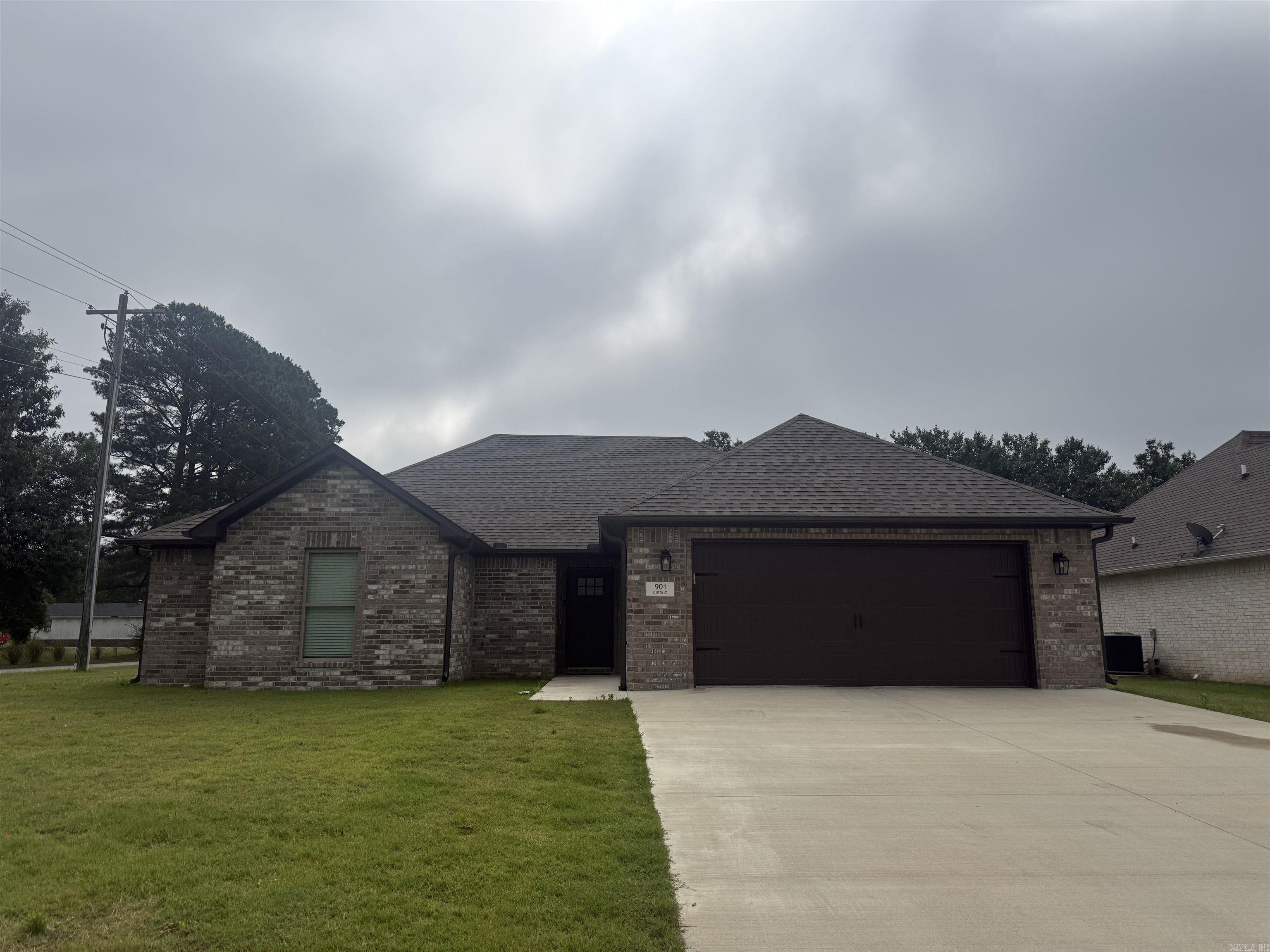 This like-new all brick home in Walcott Springs subdivision sits on a corner lot and offers a clean, modern feel throughout. Inside, the open floor plan features stained concrete floors, neutral paint colors, and an eat-in kitchen with white quartz countertops, a breakfast bar, and plenty of everyday function. The primary suite includes a double sink vanity, separate tub, and separate shower, while two additional bedrooms and a second full bath provide comfortable space. A laundry room and double garage add convenience, making this property a great option for a personal home or investment opportunity. Currently leased and available for sale.