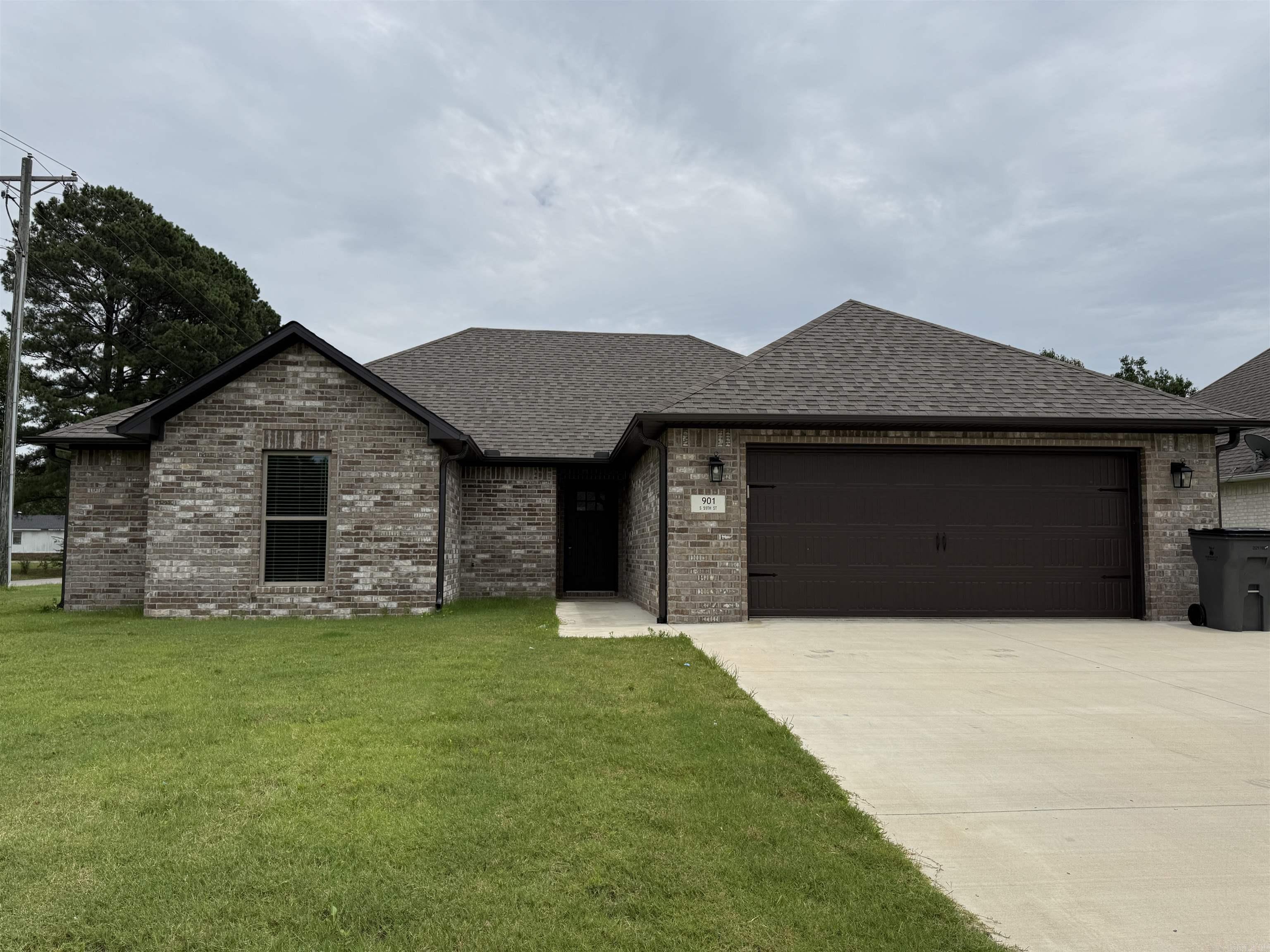 This like-new all brick home in Walcott Springs subdivision sits on a corner lot and offers a clean, modern feel throughout. Inside, the open floor plan features stained concrete floors, neutral paint colors, and an eat-in kitchen with white quartz countertops, a breakfast bar, and plenty of everyday function. The primary suite includes a double sink vanity, separate tub, and separate shower, while two additional bedrooms and a second full bath provide comfortable space. A laundry room and double garage add convenience, making this property a great option for a personal home or investment opportunity. Currently leased and available for sale.