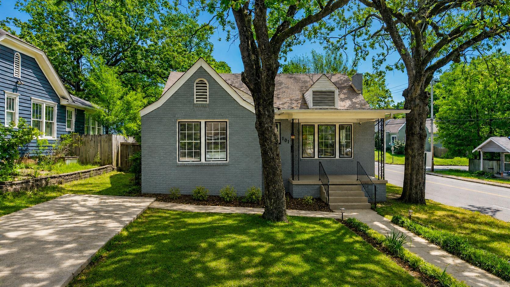 Hillcrest doesn't just attract people — it selects them. The ones who choose character over square footage, a front porch over a three-car garage, a walk to dinner over a drive to everywhere. 101 Linwood Court is built for that person. This Craftsman-Tudor bungalow sits where the back deck catches the morning sun and the covered front porch holds the evening — the hardest light always finds you in the shade. Original hardwood floors, large windows that make the outdoors feel like a room, and an updated kitchen that honors the home's history without being precious about it. The primary bedroom has a bonus sitting area and an oversized closet that will quietly become one of your favorite things about living here. The dining room built-ins speak to a time when homes were designed to be kept, not flipped. The backyard is generous by Hillcrest standards — private, unhurried, yours. Washer, dryer, and refrigerator convey. Pulaski Heights Elementary zone. Kavanaugh Boulevard, UAMS, Arkansas Children's Hospital, and downtown Little Rock all within easy reach. Some addresses are just coordinates. This one is a decision about how you want to live.