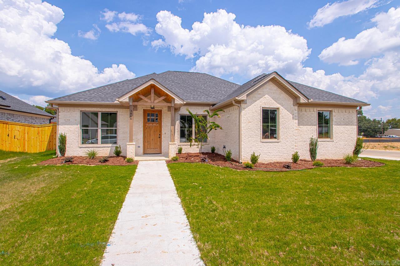 Welcome to your dream home in Benton’s premier subdivision, Spencer Crossing! This stunning brand new construction boasts a spacious split floor plan designed for modern living. Step into the heart of the home where custom-built, soft-close floor-to-ceiling cabinets adorn the kitchen, complemented by a freestanding stove & a convenient pantry for all your culinary needs. Cozy up by the brick gas fireplace in the open living area, perfect for entertaining or relaxing evenings at home. Retreat to the private primary suite featuring a luxurious primary bath complete with double vanities,  and a large walk-in tile shower, offering a spa-like oasis right at home. The split floor plan ensures privacy with spacious spare bedrooms, providing ample space for family or guests. Step outside onto the covered porch & immerse yourself in the tranquility of the backyard, where you’ll love spending time in the expansive, fully fenced outdoor living space. Whether it’s morning coffee or evening gatherings, this home offers the perfect setting for enjoying the outdoors. Don’t miss out on the opportunity to make this beautiful home yours!