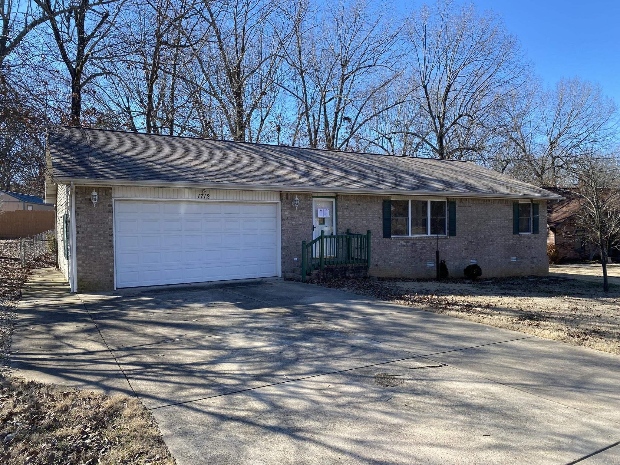 Charming 3BR, 2BA brick front home in a tranquil subdivision. Enjoy privacy in the fenced backyard with a covered deck. Additional storage building. Well-equipped kitchen, perfect for meal prep. Split bedroom plan for added privacy. Cozy up beside the gas log fireplace. Don't miss this gem!