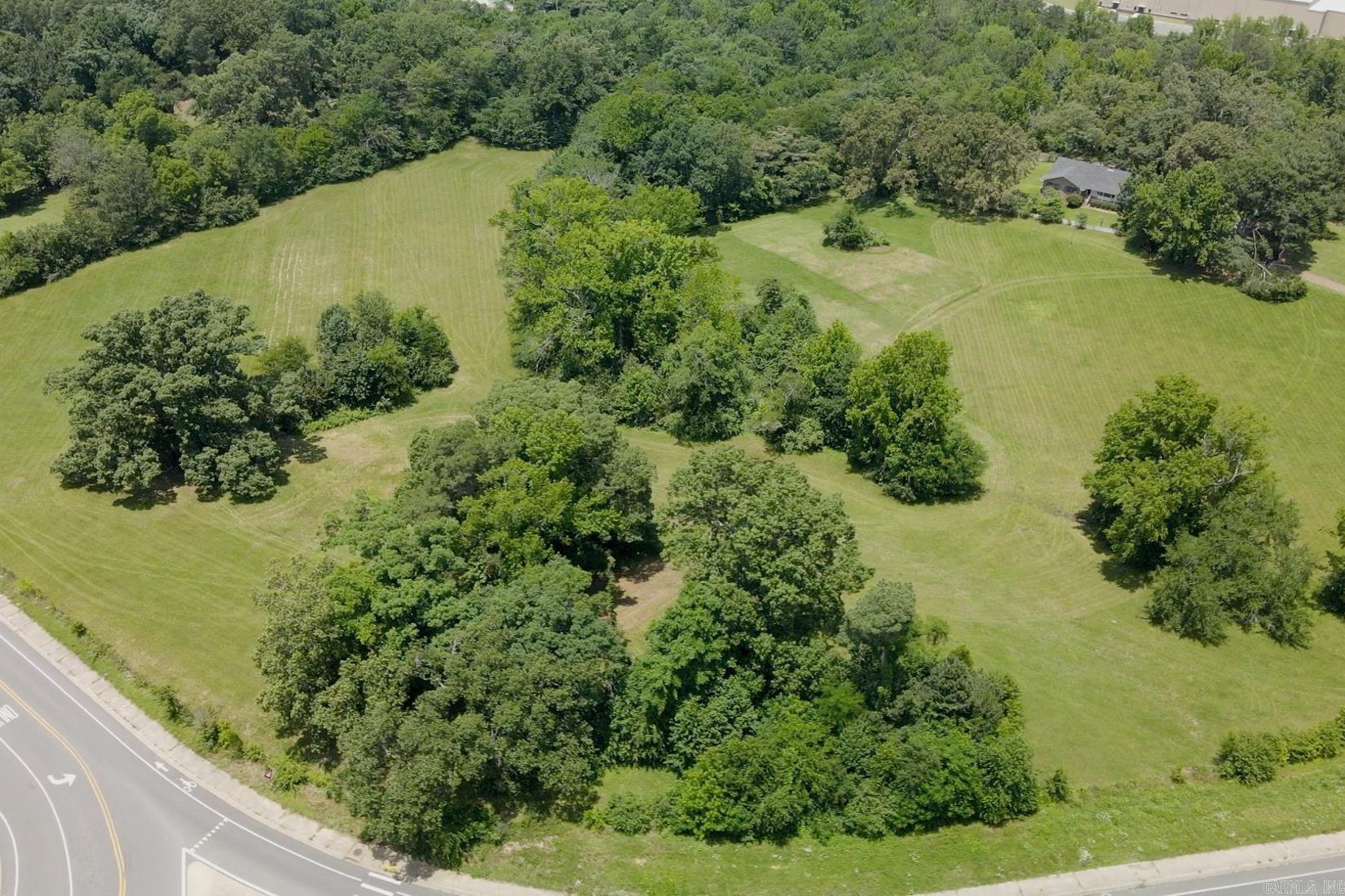 Incredible tract of land with almost 18 acres at a prime commercial location at the corner of Higdon Ferry and Lakeshore Drive. Easy access from several sides positioned perfectly between the hospital, shopping, Oaklawn Park/Casino with multiple use options and opportunities. While this property is currently zoned residential & agriculture, the city has attempted to rezone for commercial for many years (seller is prepared to work through rezoning process with buyer).Utilities available are city water, natural gas and electricity.  Contact listing agent for more information including topography/boundary survey, appraisal and disclosures.