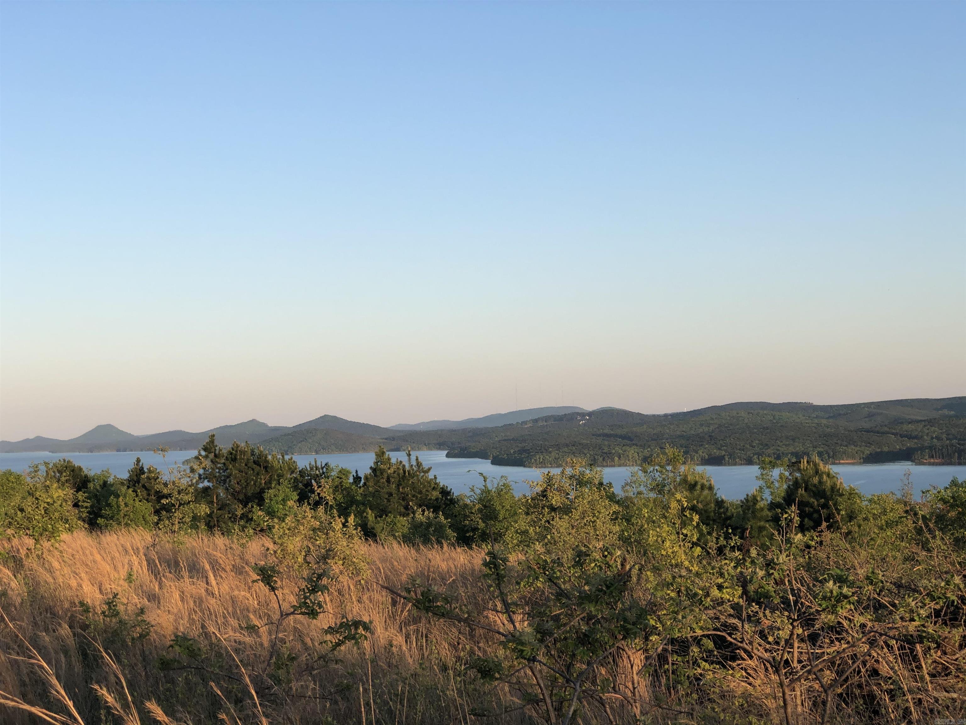 Incredible Views of Lake Maumelle, Pinnacle Mountain, and the foothills of the Ouachita Mountains on this 10 acre tract! This tract sits inside the gated neighborhood of Lakeview West, with neighborhood amenities such as pickleball, tennis, and basketball courts, walking trails etc. Much of the buildable area is suitable for a slab foundation and flat yard area.
