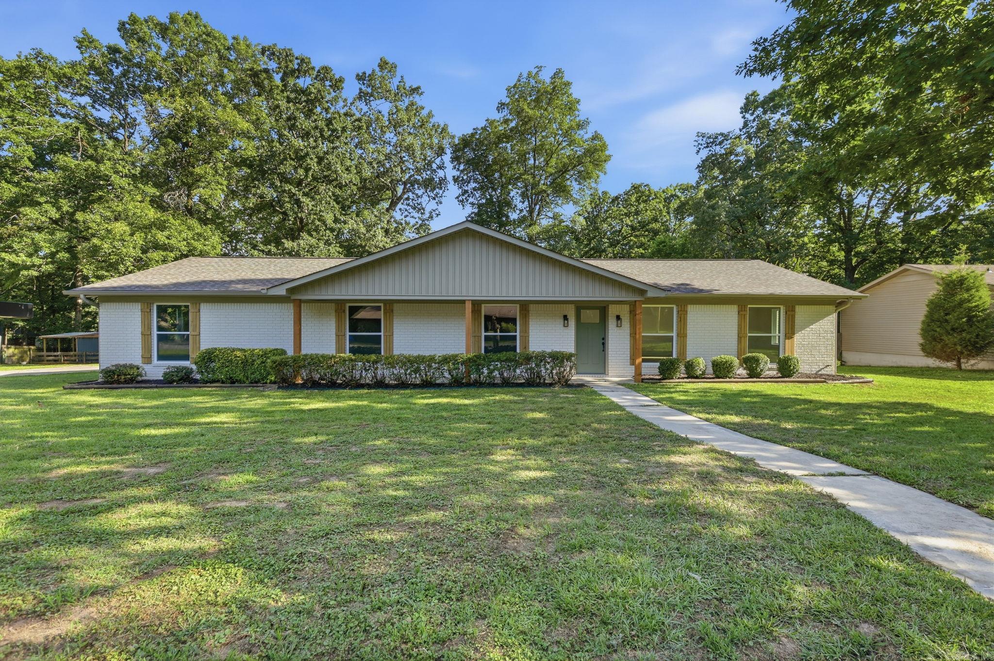 You don't want to miss this stunning, fully remodeled home located right in the middle of Bryant. When we say completely remodeled, we mean it—this home is essentially brand new! Updates include a new roof, HVAC system, plumbing, electrical, windows, floor plan, kitchen, and bathrooms. The only original features remaining are the slab and exterior brick, which have been freshly painted for a modern look. Inside, you'll find 4 spacious bedrooms, 2 beautifully updated bathrooms, and an open-concept floor plan that's perfect for entertaining and everyday living. Situated on an oversized 0.62-acre lot, this property offers a rare combination of space and convenience that's hard to find in town. With all the major updates already completed, this move-in-ready home provides peace of mind and modern style in one of Bryant's most desirable locations. Schedule your showing today before this one is gone!
