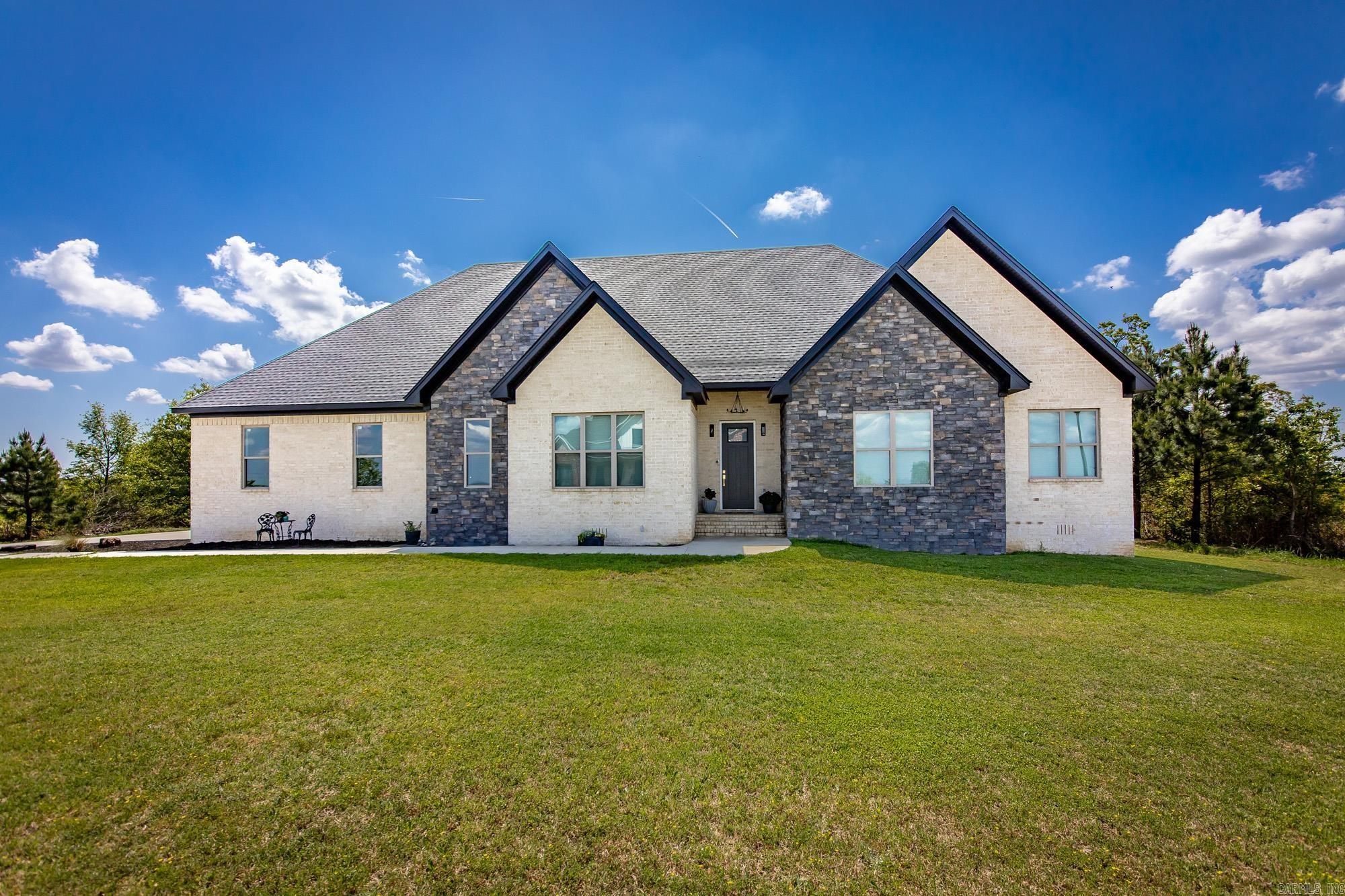 Tucked inside the gated Seven Point Lake community, this beautifully updated custom home checks all the boxes. With 4 bedrooms and 2 baths, the layout is both stylish and functional, featuring a spacious family room with luxury vinyl flooring that flows right into the kitchen—perfect for everyday living and entertaining. The kitchen offers a breakfast bar, plenty of storage, a walk-in pantry, and a clever passthrough cabinet that makes cooking and hosting a breeze. The primary suite is your private escape with a custom-tiled walk-in shower featuring a rain shower head, a generous walk-in closet, and direct access to the back porch where mountain views steal the show. Surrounded by natural beauty and tucked behind the gates, this home offers comfort, privacy, and that “this is the one” feeling the moment you walk in.
