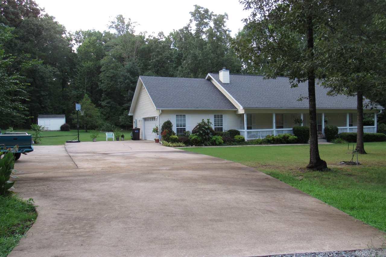 EXTREMLY CLEAN HOUSE ON 3.75 ACRES VERY NICE NEIGHBORHOOD 3 BR 2 BATH VAULTED CEILING IN LIVING ROOM WITH REAL FIREPLACE WITH INSERT WITH HEAT WHOLE HOUSE BUILT IN BOOK CASES EACH SIDE OF FIREPLACE LOTS OF OAK KITCHEN CABINETS VERY LARGE LAUNDRY ROOM SUN ROOM FLOWERS AND SHRUBS GALORE, GAZEBO, OUTSIDE STORAGE BUILDING LARGE FRONT PORCH 2 CAR GARAGE WITH LOTS OF CONCRETE PARKING FENCE ON THREE SIDES ATT DSL AVAILABLE