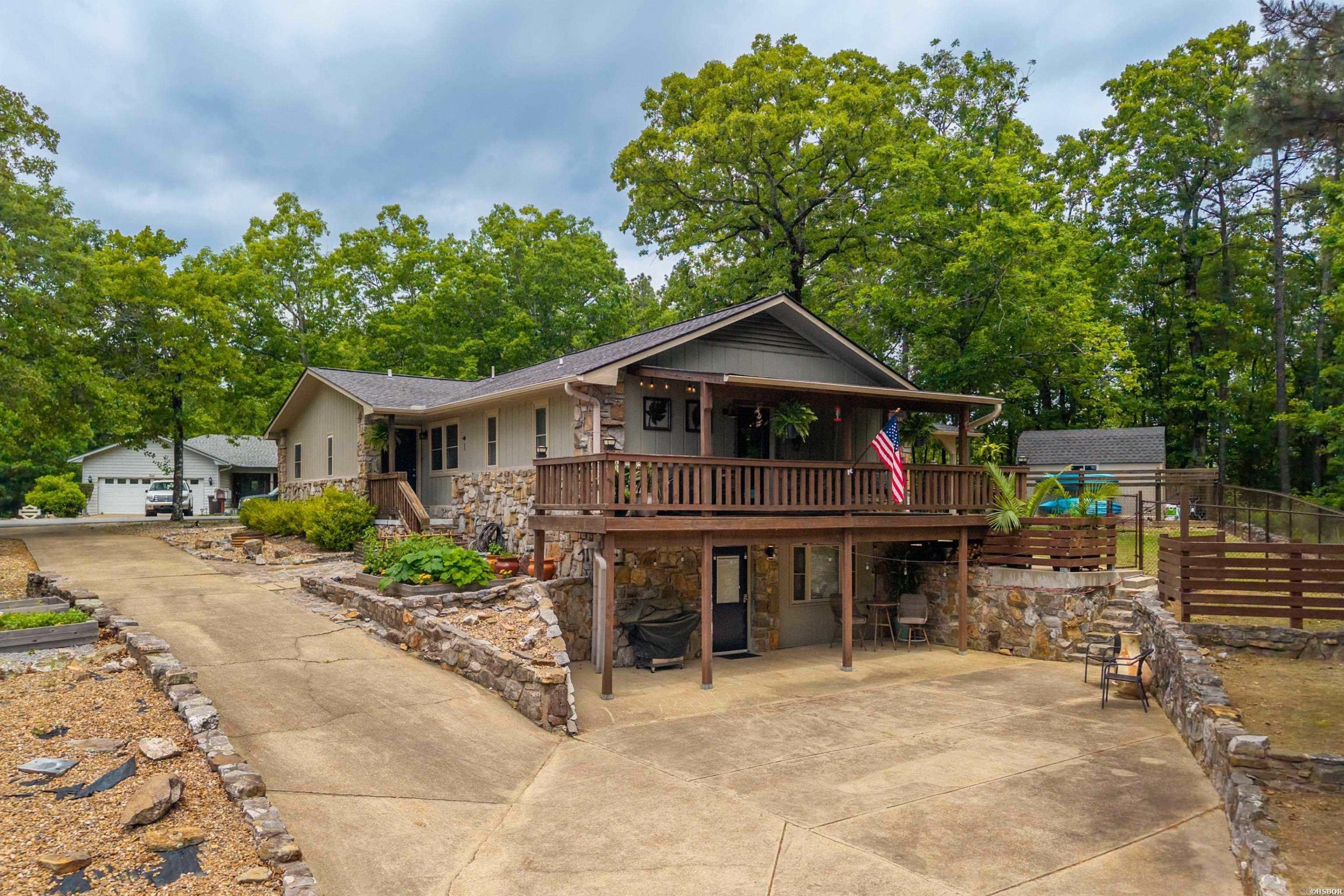 This versatile property offers a main residence featuring three bedrooms, two full baths, an office, and an inviting living area anchored by a wood-burning fireplace. The primary bedroom includes a custom built-in dresser for added storage and character.  Outside, you’ll find a level, fully fenced backyard with a patio area and storage shed, all complemented by mountain views across the street that become even more pronounced as the seasons change. In addition to the main living area, the property includes a walk-out guest suite with its own living area, bedroom, full bath, kitchen, and washer/dryer hookups.  The driveway extends directly to the suite's dedicated entrance, providing effortless access and privacy from the upper level and backyard. This self-contained space has a proven track record as a successful nightly rental and is equally ideal for a mother-in-law suite or multi-generational living.  Whether you’re looking for extra living space, room for guests, or income potential, this property offers a setup that’s hard to find and easy to make your own.