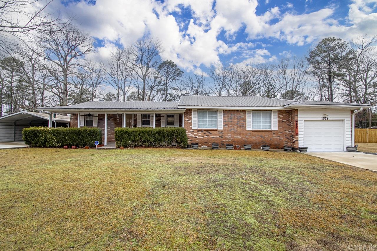 Charming older brick house with timeless appeal. This 3-bed, 3-bath home spans 2036 sq ft, featuring a classic design and a durable metal roof under warranty. Granite countertops. Large walk-in tub installed in 2020. The property boasts an in-ground pool, pool house, 24x30 shop, and shed, creating an ideal outdoor oasis. A new septic system was installed in June 2023. Don't miss the perfect blend of character and comfort in this well-maintained residence.