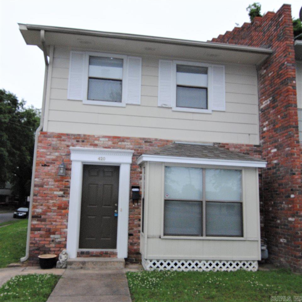 Spacious town home in the Historic Argenta District.  2 blocks to Dickey Stephens Ballpark, 3 blocks to Main Street.  Large living area with picture window, 1/2 bath down, furnished kitchen w/extra pantry & washer/dryer closet (hookups only-electric).  Two bedrooms upstairs each with private 1/2 bath and entry to bath/shower.  Gated back patio for privacy.  Assigned parking, lawn care included.