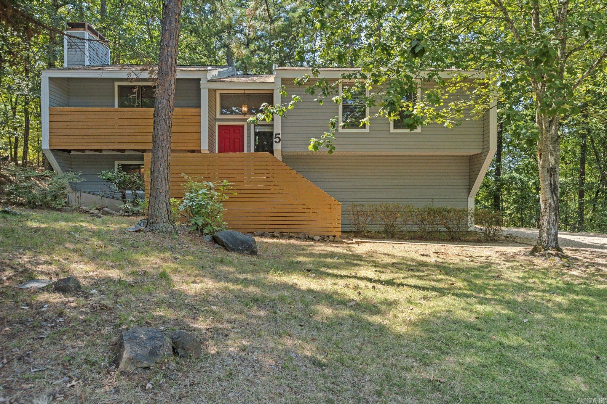 Non-Smoking two-story 4 bedroom house located on a wooded lot on a cul-de-sac in the Stone Ledge area of Maumelle. The house has a two car garage, three private decks and a patio. Inside is a Great room with wood-burning fireplace, dining room, a den downstairs, and three full bathrooms. The house has central heat and air, w/d connections, carpet and tile floors, ceiling fans, and window coverings. The kitchen is furnished with an electric stove, dishwasher, disposal, and a French-door style refrigerator.