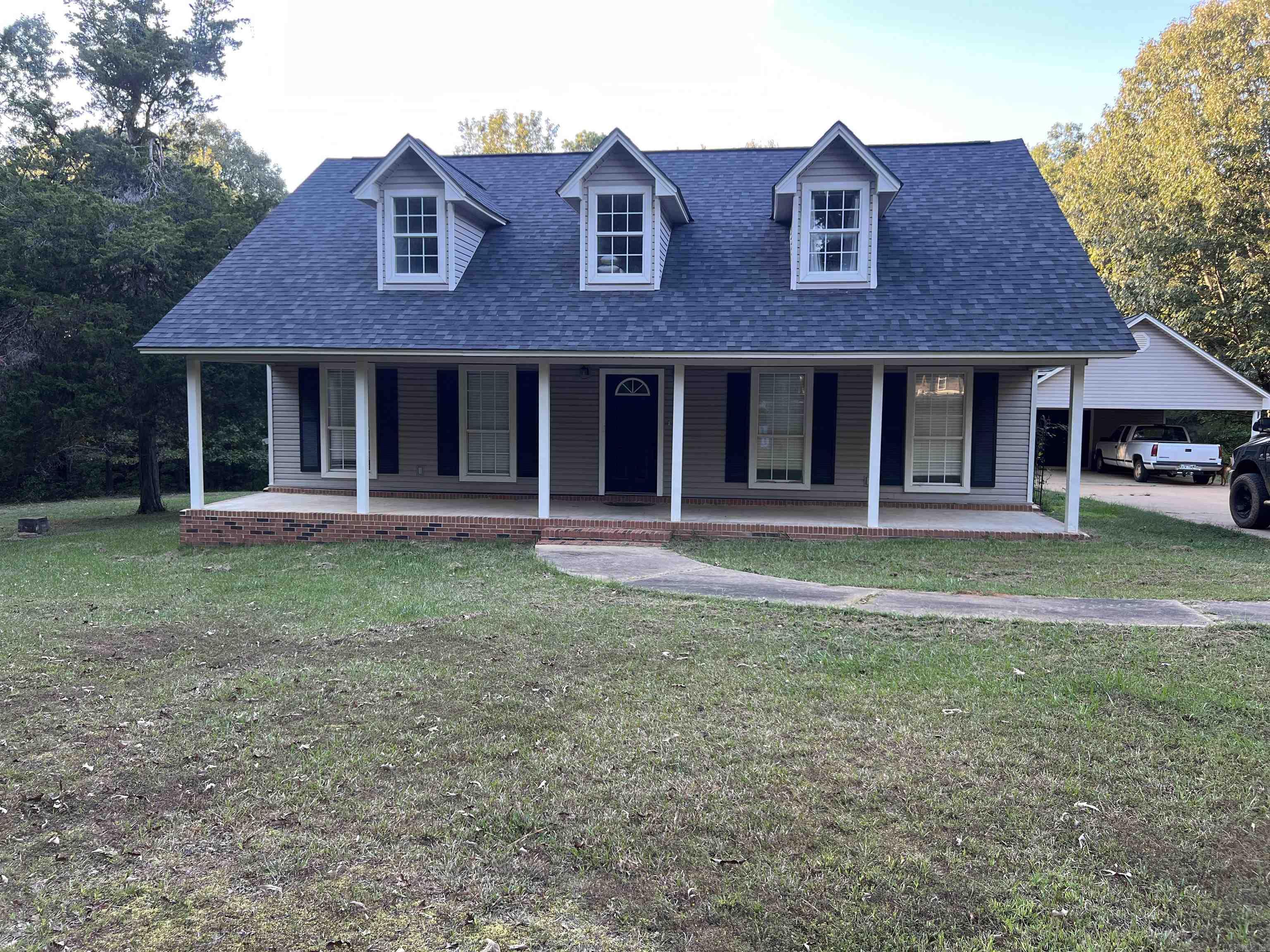 Beautiful two story 4 bed 2 bath brick and frame home on almost 8 acres with a porch on the back and detached two car garage.  This home has beautiful updates including paint, new flooring, and tiled showers.  It has three bedrooms on the main level, large living room with a gas log fireplace, an eat in kitchen with mudroom off of the kitchen area. Upstairs you will find the 4th bedroom, large sitting area, bathroom and spacious closets for storage.  Don't miss this opportunity for a beautiful home on beautiful acreage.