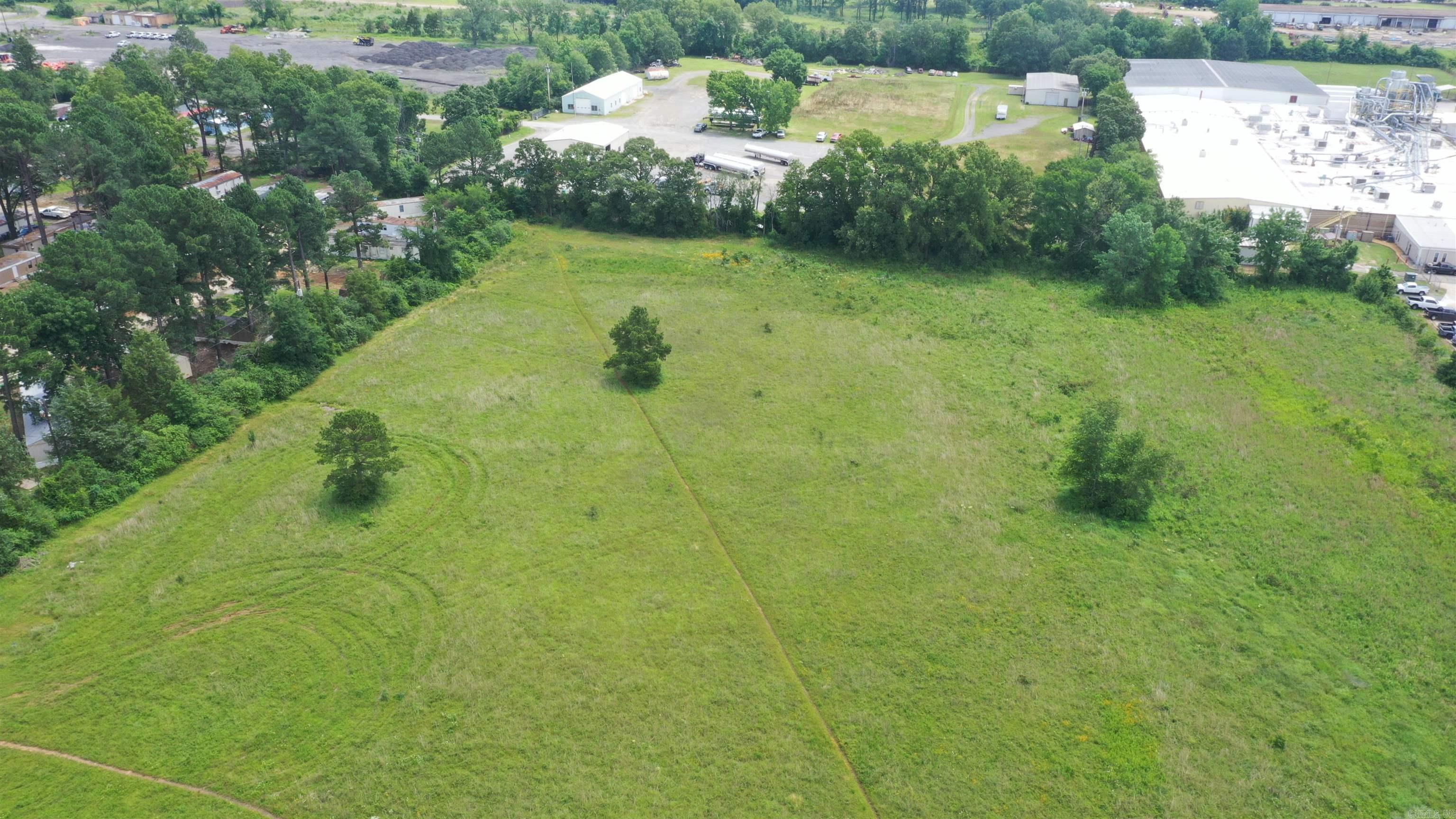 ZONED C-3.  This property has many possibilities for commercial development.  Great place for Storage units for Boat or RV storage, large construction company, trucking company, etc.  It is conveniently located only minutes from I-40, hospital, industrial Park, and downtown area.  See survey attached to documents.  Drone pictures available.  Attractive for any business seeking accessibility and high traffic area.  Call listing agent for more information or questions. See virtual tour video.