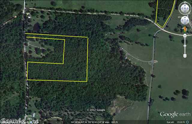 14.6 acres of mixed hardwood on a paved road. Fenced on 3 sides.