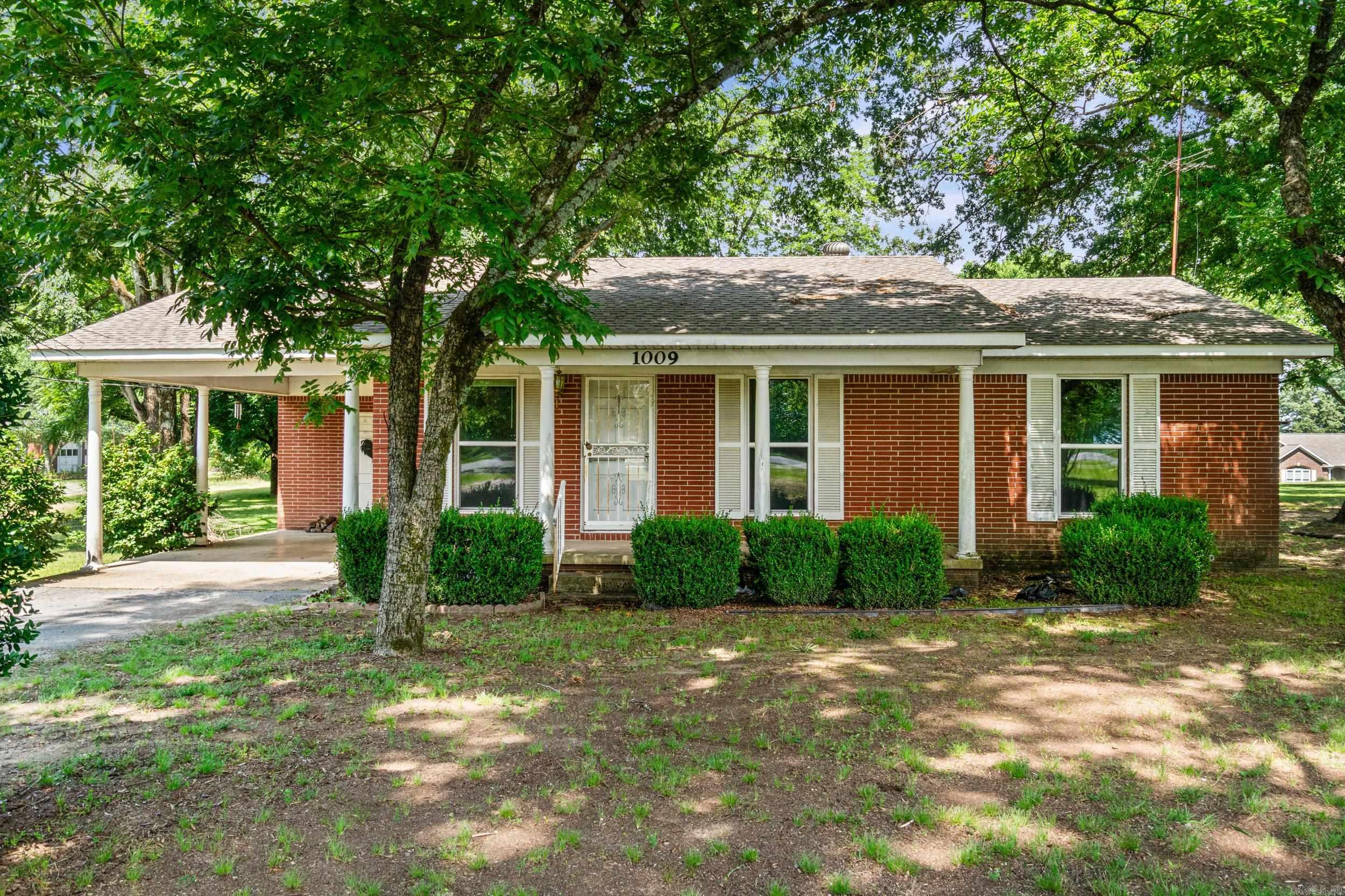 Bring your horses! This adorable 2-bedroom, 1.5-bath home sits on 5 beautiful acres in Bryant School District and offers plenty of possibilities. The flexible floor plan includes a separate den and eat-in kitchen, creating the potential for a third bedroom by converting the living room and still maintaining comfortable living space. Major updates within the last five years include a new roof, new water heater, and all new thermal double-pane windows. The property is all electric and features both city water and a private well, perfect for gardening, washing vehicles, filling stock tanks, or other outdoor needs. Zoned Residential Estate (RE), you'll enjoy the freedom of country living with room for livestock, hobby farming, and more. A large metal shop plus two additional outbuildings offer the flexibility to accommodate everything from tools and tractors to recreational vehicles. Come check it out!