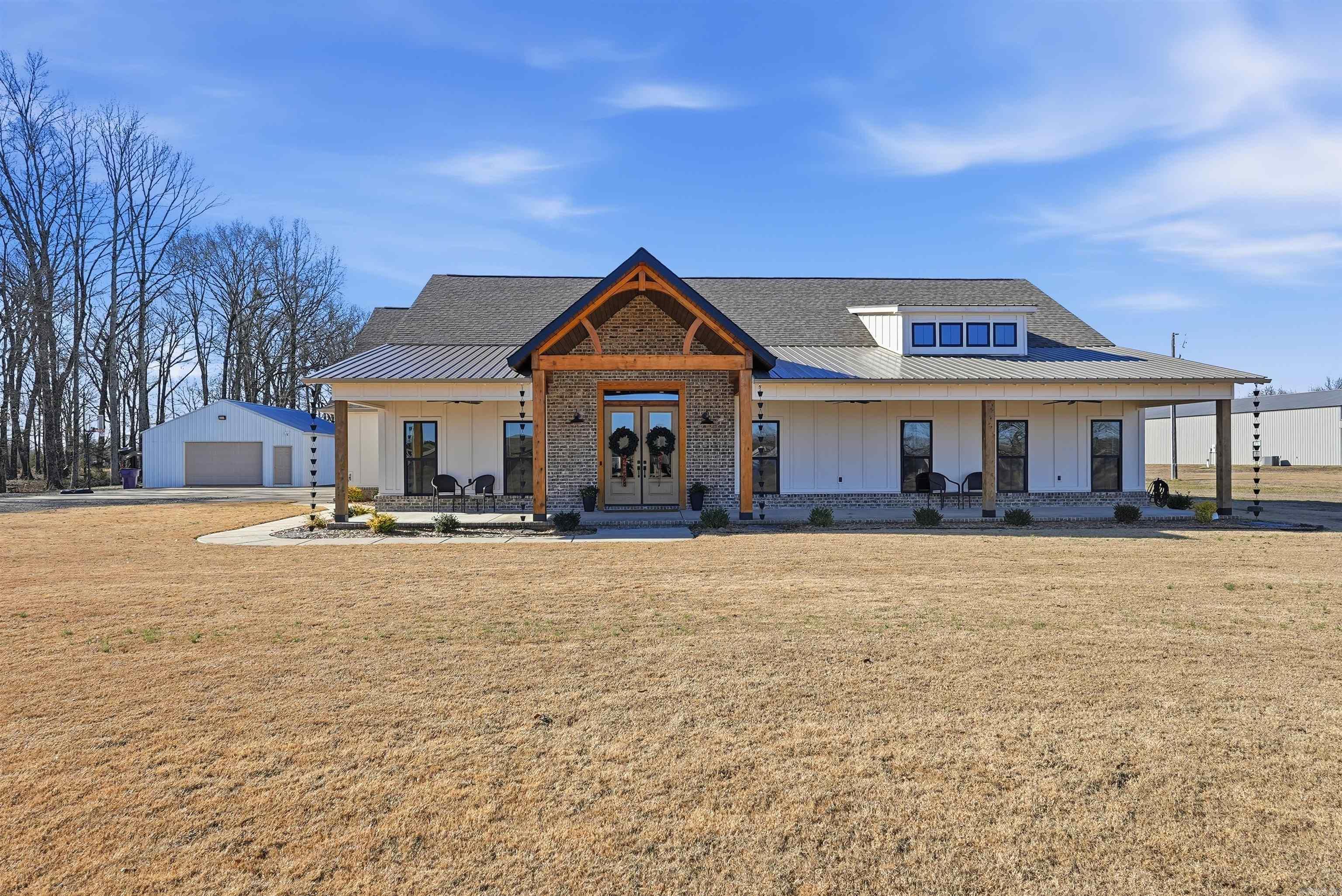 Completed in 2023, this absolutely stunning modern farmhouse is PACKED with detailed features like custom floor-to-ceiling brickwork, built-in bookshelves, a freestanding wood-burning stove, and a gourmet kitchen with a professional-grade gas range and double oven with a butler's pantry and a walk-in pantry. The 880 sq.ft. bonus room provides the perfect setting for a media or entertainment room, while the safe room keeps the family safe! Schedule your private tour today!
