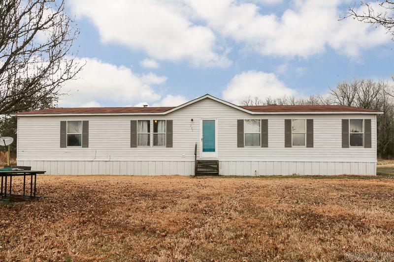 Country home on three acres. This 3 bedroom, 2 bath home is great for your family. Huge living room! Formal dining room that can be used as a 4th bedroom. Eat in kitchen with tons of stained cabinets and counter space. Large pantry. All bedrooms are big with large closets. Mater bath is giant with a soaker tub, double vanities and separate shower. Three acres gives your family plenty of room to roam. Storm shelter. Large parking area. All this on a permanent foundation! Call today! This won't last long!