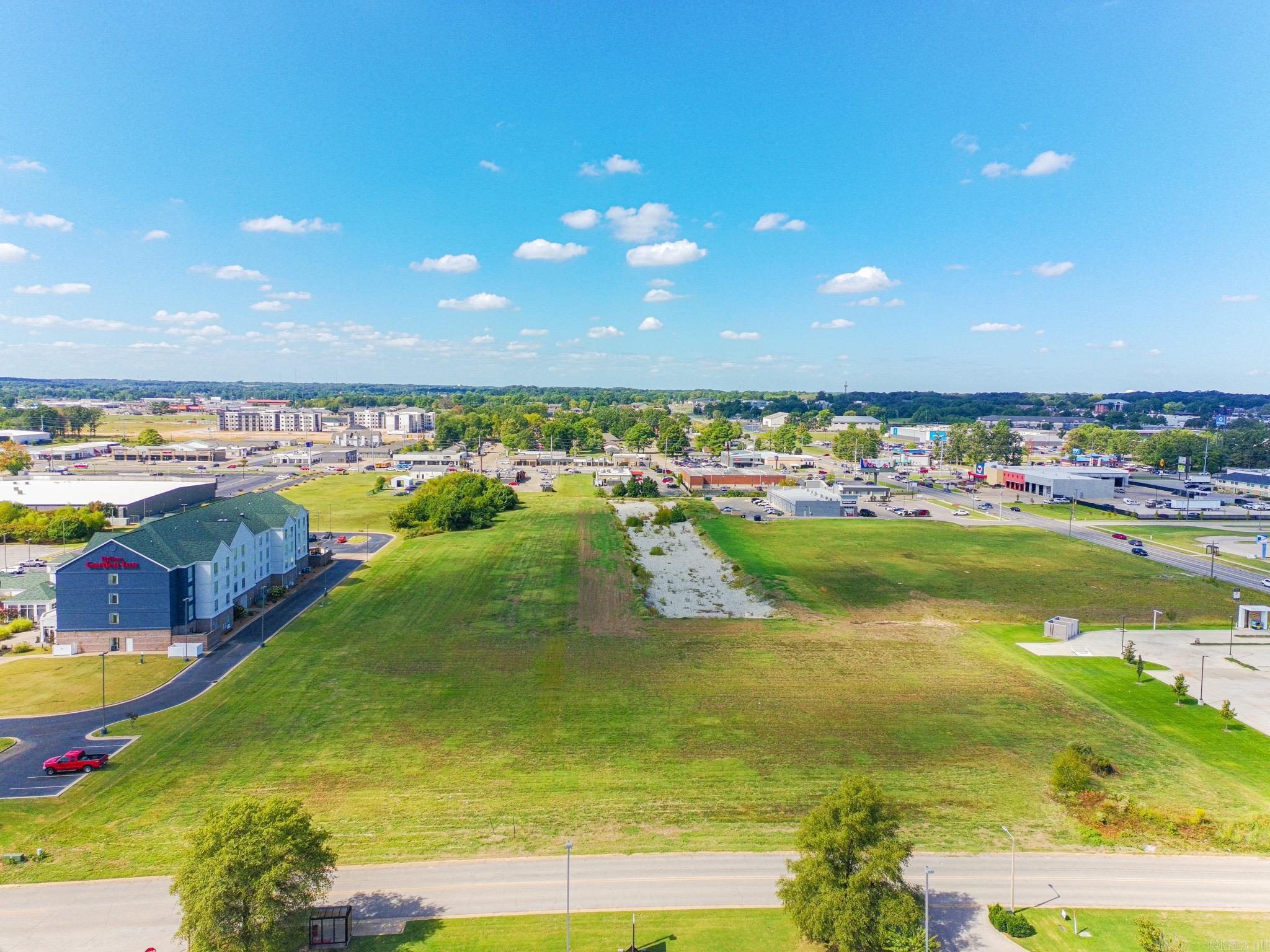Great location! This property sits near the corner of Race St and Fair Park Blvd, a major connecting road in the heart of Jonesboro from Red Wolf Blvd (Hwy 49) and Caraway Rd, making this property a developers dream. Neighbor to FNBC Bank, across from Plato's Closet and 1812 Pizza Company, adjacent to the United States Post office, Gateway Tire, Aldi Grocery, a newly constructed shopping center and more. This lot and all available lots can be replatted smaller or larger. All utilities are available. All water detention has been completed by developer.