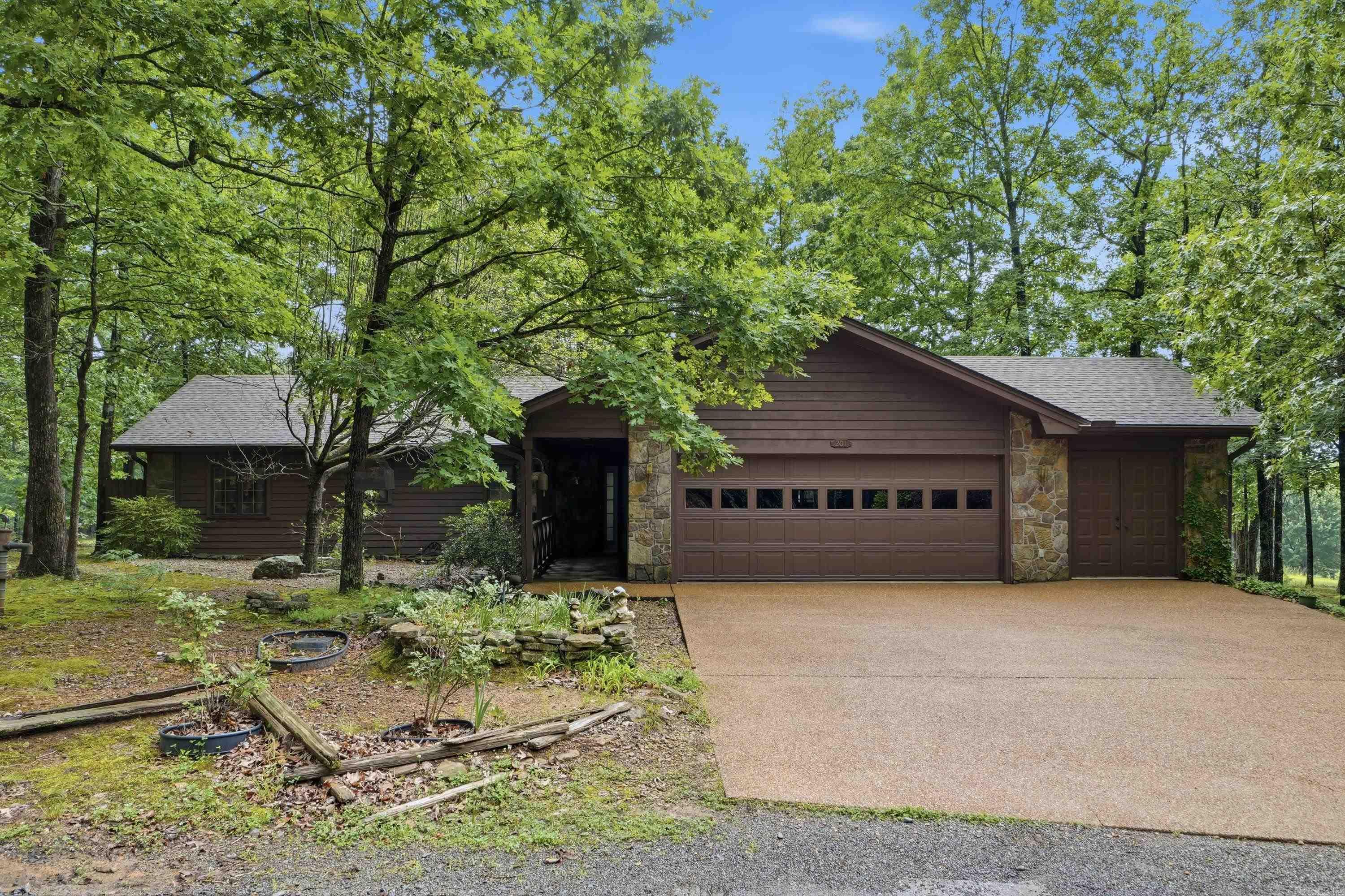 Rare opportunity to own a one-owner custom home on Indian Hills Golf Course. Built by a highly respected local builder & thoughtfully designed by a renowned Fairfield Bay architect, this exceptional property offers 1.48 acres on end of the culdesac with the rare combination of golf course frontage & beautiful pond/lakeviews.  Designed for comfortable, step-free living, this well-maintained home showcases beautiful wood floors, solid wood doors, quality Anderson windows, & a stunning floor-to-ceiling stone fireplace. The spacious sunroom provides the perfect place to enjoy nature, wildlife, & peaceful golf course views. A practical floor plan includes a generous pantry & utility room, while golf enthusiasts will appreciate the workshop/golf cart storage. The Indian Hills Pro Shop, Restaurant, & Driving Range are just a short golf cart ride away. Pride of ownership is evident throughout this meticulously cared-for home. Recent improvements include a newer roof & water heaters, providing peace of mind for years to come. Offering quality craftsmanship, exceptional maintenance, & an unbeatable golf course setting, this is a rare property you won't want to miss. GOLF CART CONVEYS.