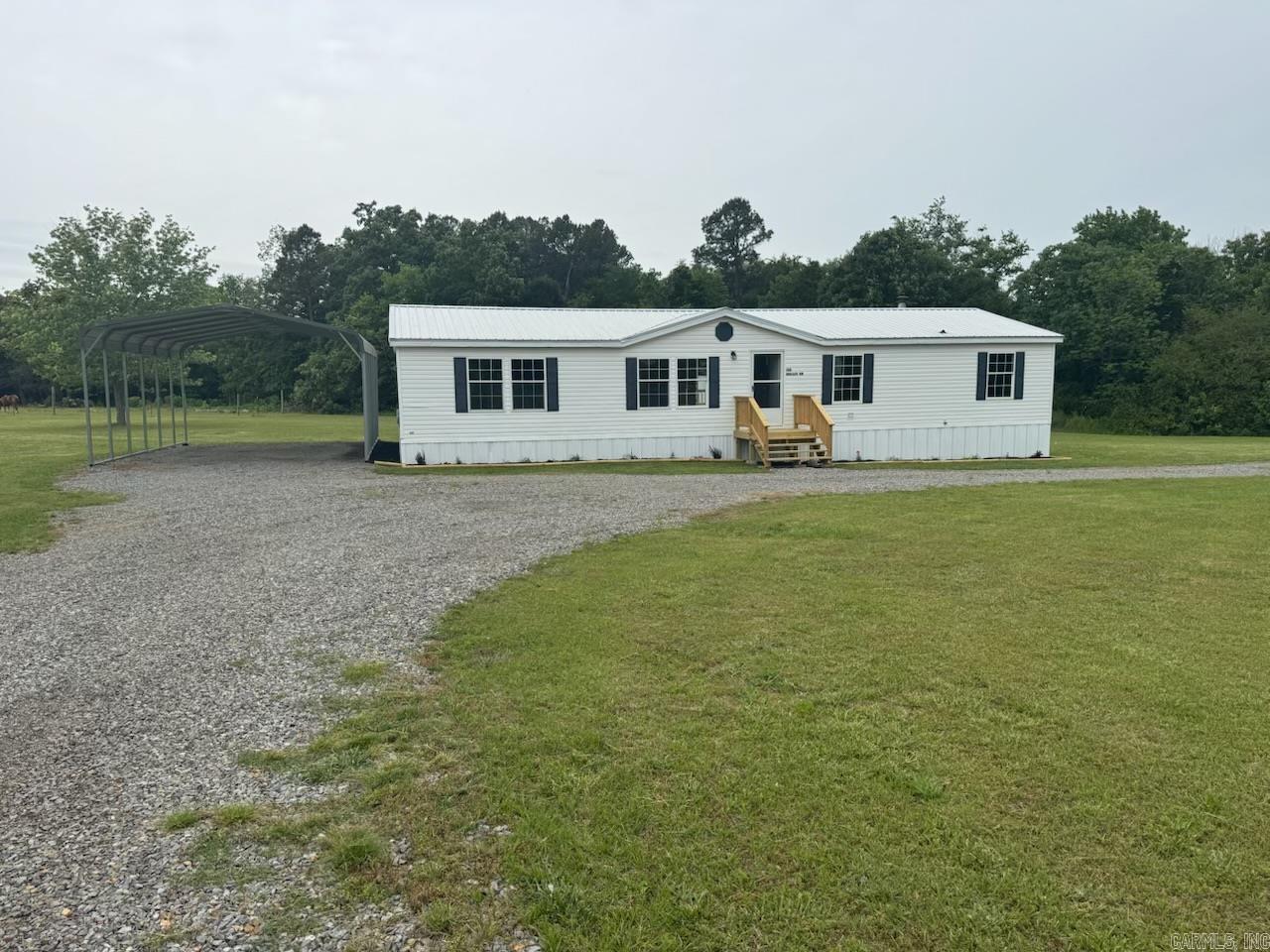 Charming country retreat on 2.5 acres! This beautifully remodeled mobile home offers the perfect blend of modern comfort and peaceful rural living. Nestled on a spacious, private lot, the property provides plenty of room for gardening, outdoor activities, or simply enjoying the quiet surroundings. Inside, you’ll find a completely updated interior featuring fresh paint, new flooring, and stylish finishes throughout. The open-concept living area is bright and inviting, flowing seamlessly into a fully renovated kitchen with updated cabinetry, countertops, and appliances. The home includes comfortable bedrooms and updated bathrooms designed with both function and style in mind. Step outside and enjoy the wide-open space—ideal for pets, hobbies, or even adding a workshop or additional structures. Whether you're looking for a starter home, downsizing, or investing, this move-in-ready property offers excellent value.