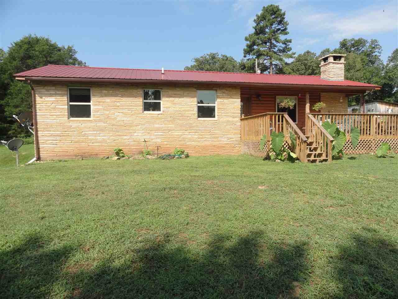 Remodeled, well built, 1,365 sq ft home with a 1,365 sq ft unfinished, heated/cooled, full walk-out basement . Rustic home, 10 acres, end of road, private, quiet & secluded yet only 4/10 mile to pavement & Hwy 74.Covered front porch & open front deck. Plenty of good well water. Fenced, ready for horses or any livestock. Small storage/tack room, pond and 18'x30' pole barn. Central H/C (heat pump).  Huge fireplace main floor or install woodstove in basement. Lots of wildlife, room for a garden, peace & quiet.