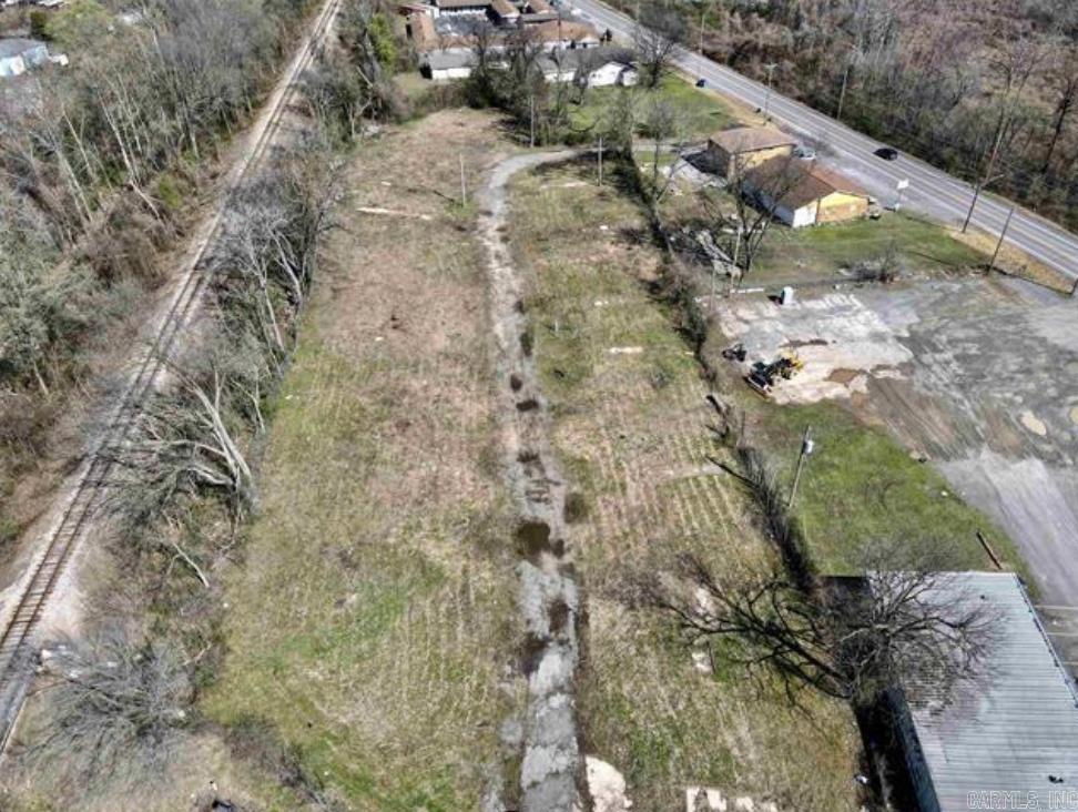 Fantastic commercial opportunity! 2.42 acres in North Little Rock previously used as a mobile home park. Septic tank. Electrical lines and gas lines are present. 2 entrances/exits. Laundry-mat and convenience store next door. Restaurants and Dollar General within walking distance. 5 minutes from I40. Zoned C3. Full lot dimensions are: 46'x19'x17'x13'x115'x506'x170'x105'x149'x28'x131'x472'
