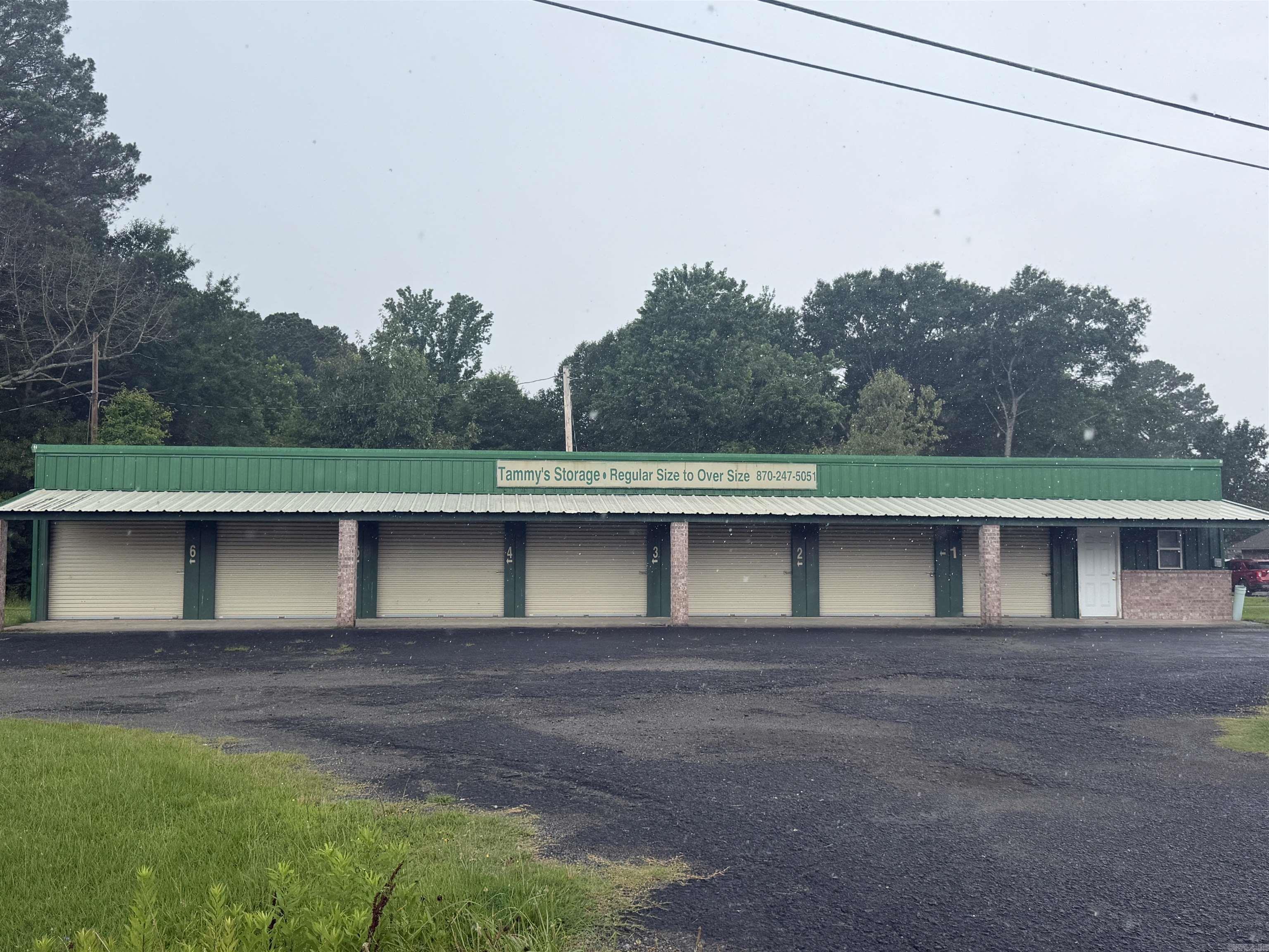 Great investment opportunity with highly visible, high traffic location with this 4 unit storage facility with and additional office space. Two units are 15x25 and two are 15x10.  Currently vacant but great opportunity for your investment property.