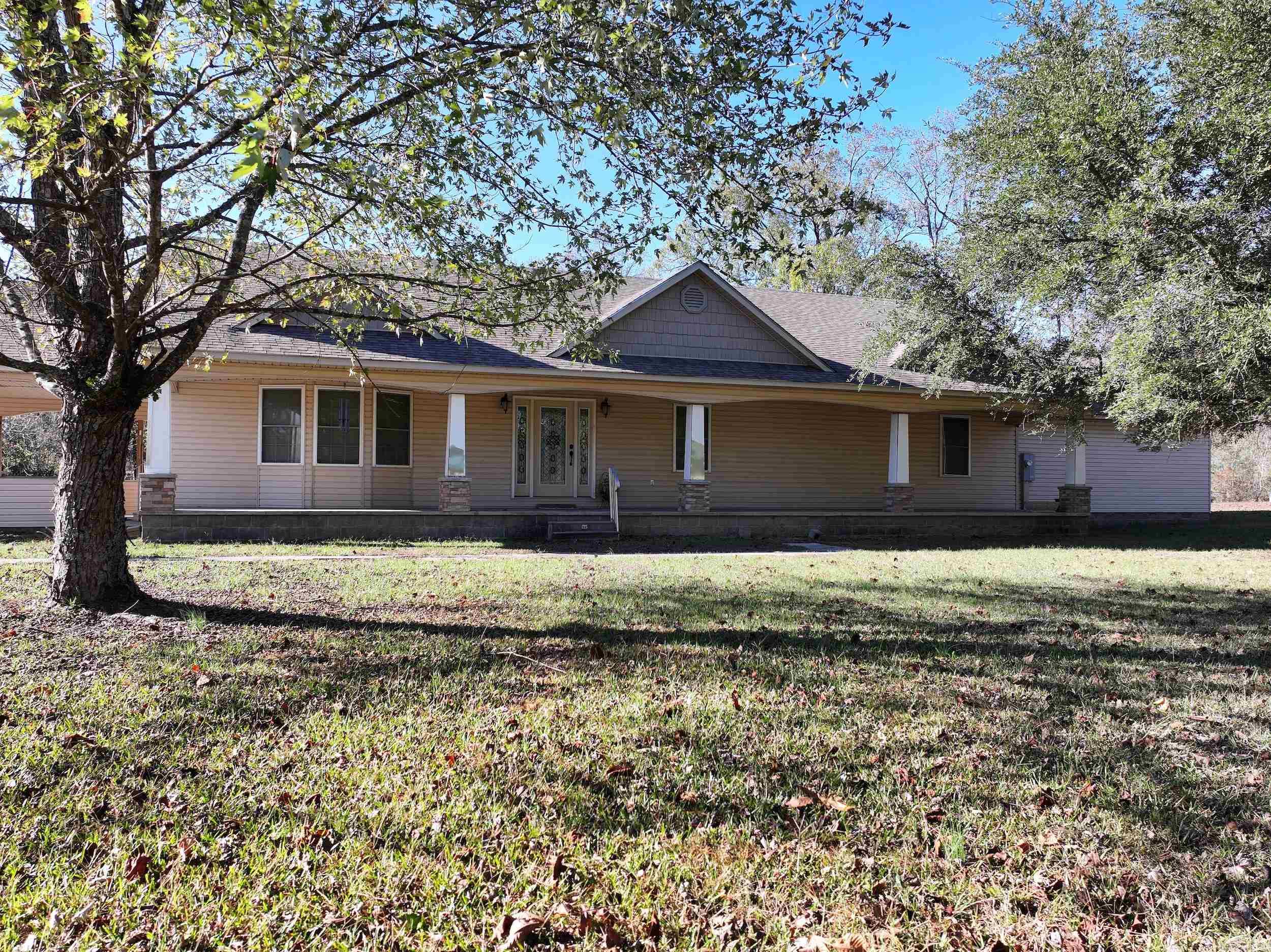 Custom-built home offering approximately 3,871 sq. ft. of living space on 4.37± acres with convenient access to HWY 70. This property features 3 bedrooms and 4.5 bathrooms with a thoughtful, functional layout throughout.  The main level includes an open-concept kitchen with a breakfast nook, a formal dining room, and a spacious living area. The primary suite offers a private office space, while an elevator provides access to the finished walk-out basement with additional living space and a safe/storm room.  Two large shops offer excellent storage or workspace options. An oversized laundry room with dual washer and dryer hookups adds everyday convenience. With ample acreage and versatile indoor and outdoor spaces, this property is designed for comfort, flexibility, and modern living.