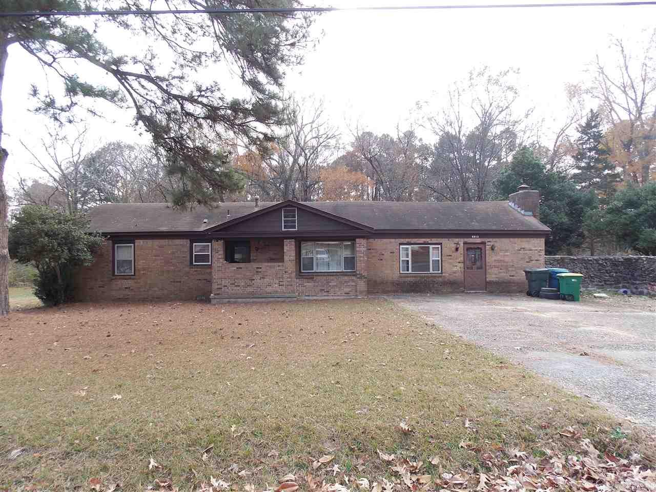 Investors take a look!  This home has a fully fenced backyard and is on 2.3 acres in a quiet neighborhood in Mabelvale.  Mobile home is included and located so that property may be subdivided and have enough space for two families.  House and mobile to be sold as-is.