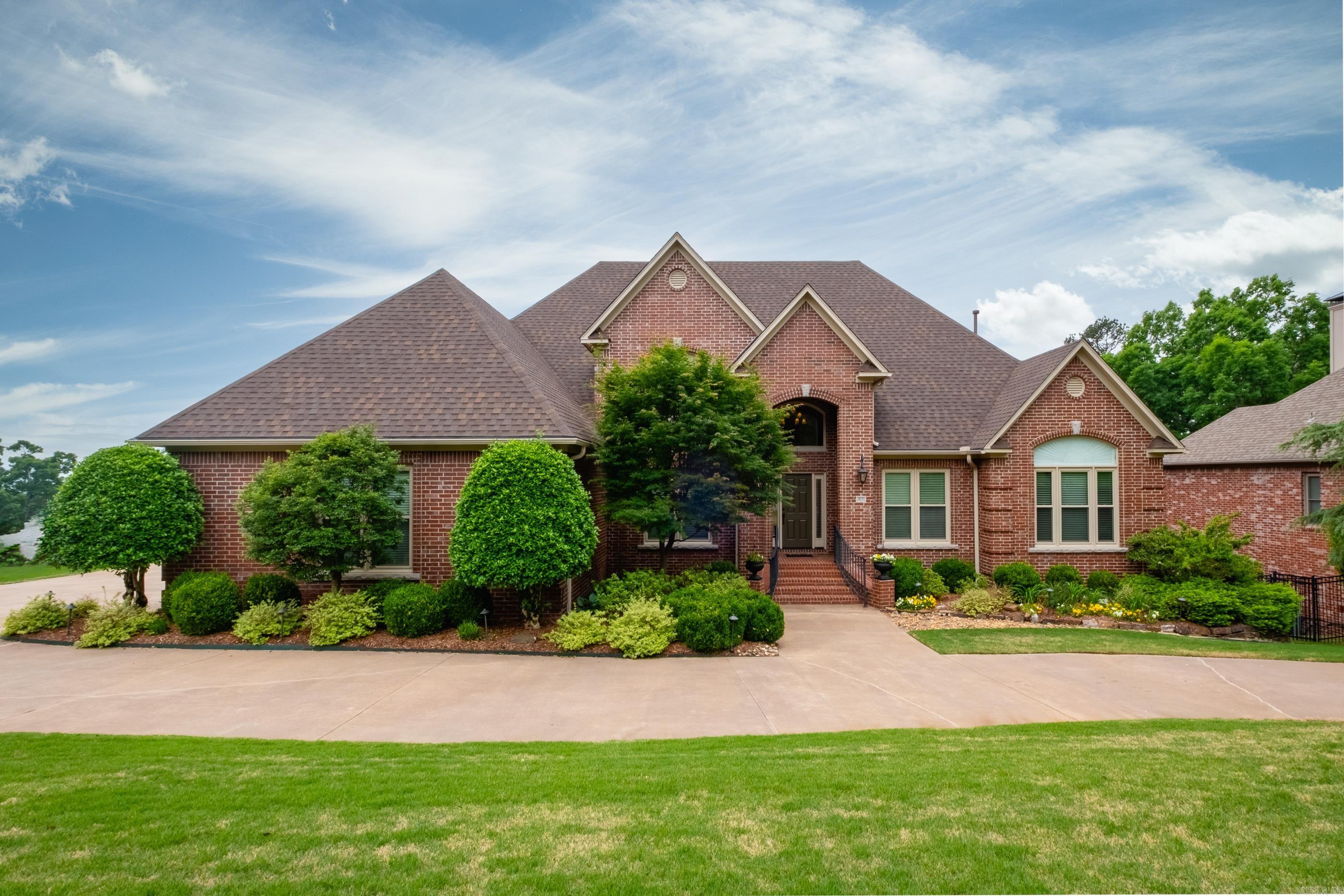 This home is a showstopper! Don't miss out on this spacious, well-built, and meticulously maintained Chenal home in the highly coveted LaMarche subdivision.  Situated on beautifully landscaped @ oversized lot, this property features amazing spaces for family living that include a majestic foyer boasting original hardwoods flanked by a formal dining room and office. The spacious kitchen is complete with updated custom cabinetry, high-end appliances, quartz countertops opening into the warm and cozy family room. The main level includes a large primary suite with walk-in closet and built-ins and is situated apart from two spacious guest rooms w/ Jack & Jill bath. The upper level offers two additional bedrooms with J&J bath. The lower level stands out with a game-room, beverage bar, and an additional guest suite. Relax and watch peaceful sunsets from any level and start making lasting memories in this FOREVER home. Other features: 2017 HVACs, 2018 Kitchen renovation, hot water tanks and crawl space encapsulation, 2019 all new windows, 2020 whole house generator, 2022 composite decking and new fence, 2024 Roof gutters and downspouts. Call today for a showing!!