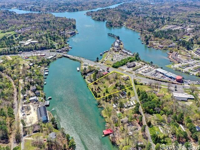 This amazing mixed use property is a rare find;  It is zoned C-4, contains 3.29 acres, with 255 feet on Albert Pike, 130 feet on Bull Bayou, and 376 feet on Lake Hamilton.  Average daily traffic count is 34,000 cars per day.