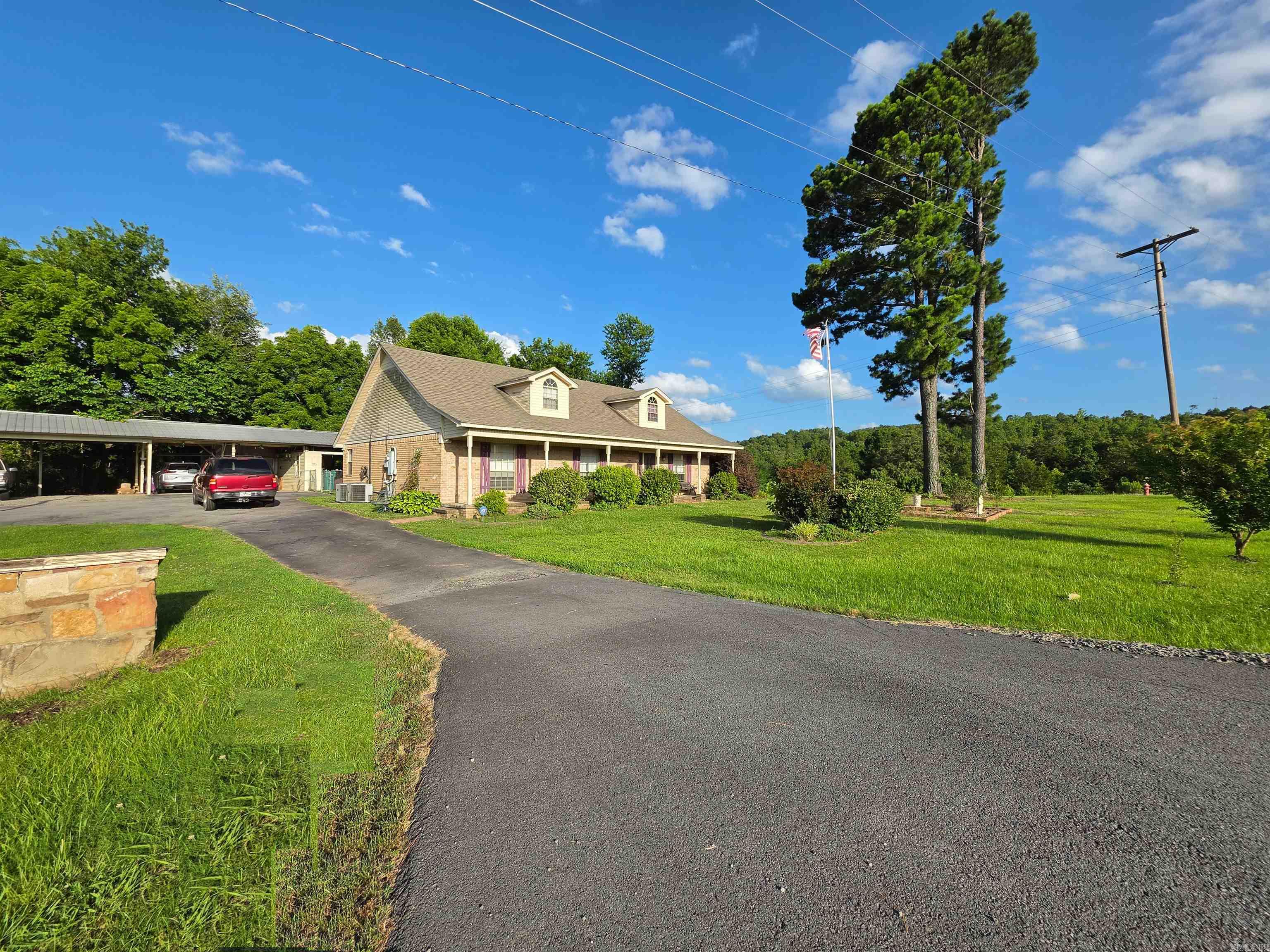 Discover the perfect blend of space, comfort, and country living with this 2,793-sq-ft brick home with 1,650 sq-ft detached garage and 2,700 sq.ft. of storage under roof set on 2.29 peaceful acres in rural Faulkner County.   Located just 13 miles from I-40 at the Salem Road Exit 124, this property offers the privacy of a rural setting with the convenience of quick access to Conway, Greenbrier, and surrounding communities. Situated in the highly regarded Greenbrier School District, this home is ideal for anyone seeking room to grow.  This spacious 5-bedroom, 3-bath home is designed with functionality in mind. Every bedroom features its own walk-in closet.  The split-bedroom layout provides privacy for family members or guests, while the generous common areas make it easy to gather, entertain, or simply enjoy everyday living.  The home is served by city water and a septic system, giving you the reliability you want with the independence you expect from rural property. The acreage offers plenty of room for gardening, outdoor hobbies, or simply enjoying the open space and quiet surroundings.  For those who need extra room for tools, equipment, hobbies, or a business, this is Your Home.