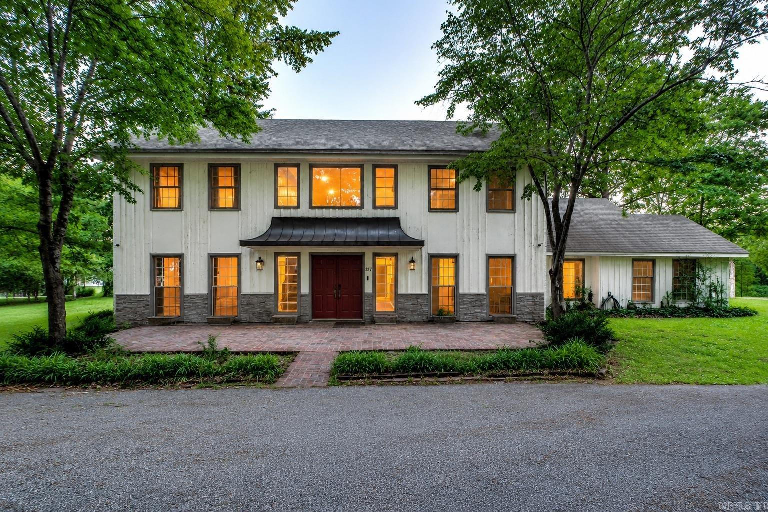 This meticulously remodeled home offers move-in ready living with extensive updates & high-quality finishes throughout.  Situated on a +-1.96-acre lot, the property provides privacy, space, & modern comforts in a convenient NEA location. The standout gourmet kitchen features elegant gray shaker-style cabinetry, stainless steel appliances, and a designer tile backsplash. The open-concept living areas boast new wood-look flooring, fresh neutral paint, recessed lighting, and abundant natural light.   Additional highlights include: • Dedicated main-level office space, ideal for remote work or a home business • Spacious upstairs bonus room, perfect for a 4th bedroom, media room, or flex space • Updated bathrooms with modern fixtures & stylish finishes • Charming sliding barn doors that add character & functionality • Brand new kitchen and laundry appliances This turn-key property has been thoughtfully updated with premium finishes & attention to detail. A rare opportunity combining substantial square footage, land, & quality remodels