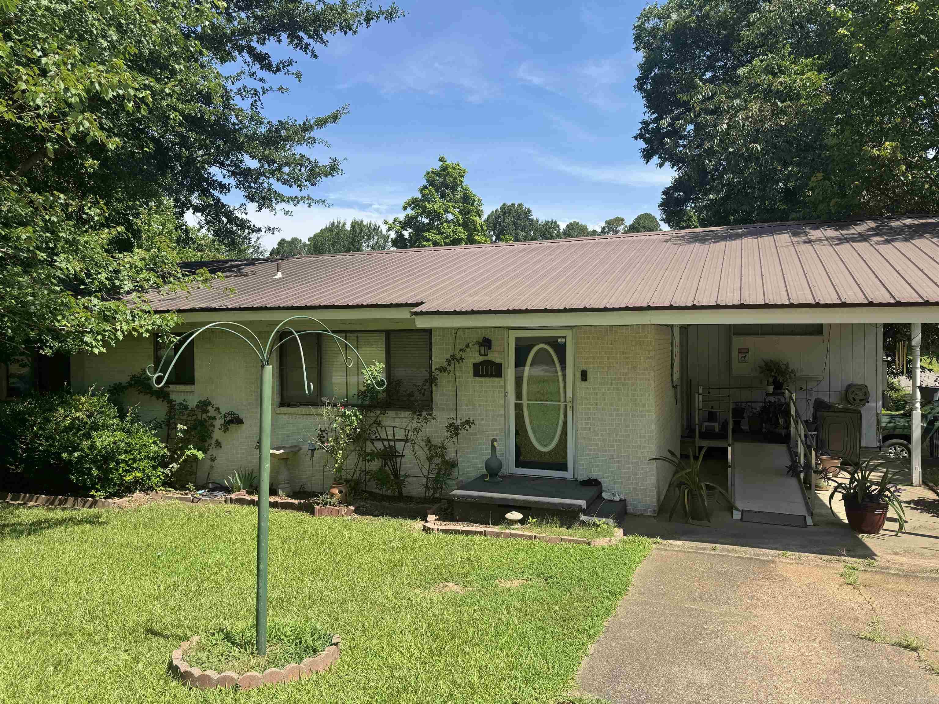 Nice home on a corner lot just two blocks from Reynolds Elementary School! Originally a 2-bedroom, 1-bath home, it has been expanded over the years to provide additional living space. The kitchen has been updated with a more recent remodel, and the enclosed back porch now serves as a versatile bonus room or den, complete with a second full bathroom. Agents, please see remarks for additional information.